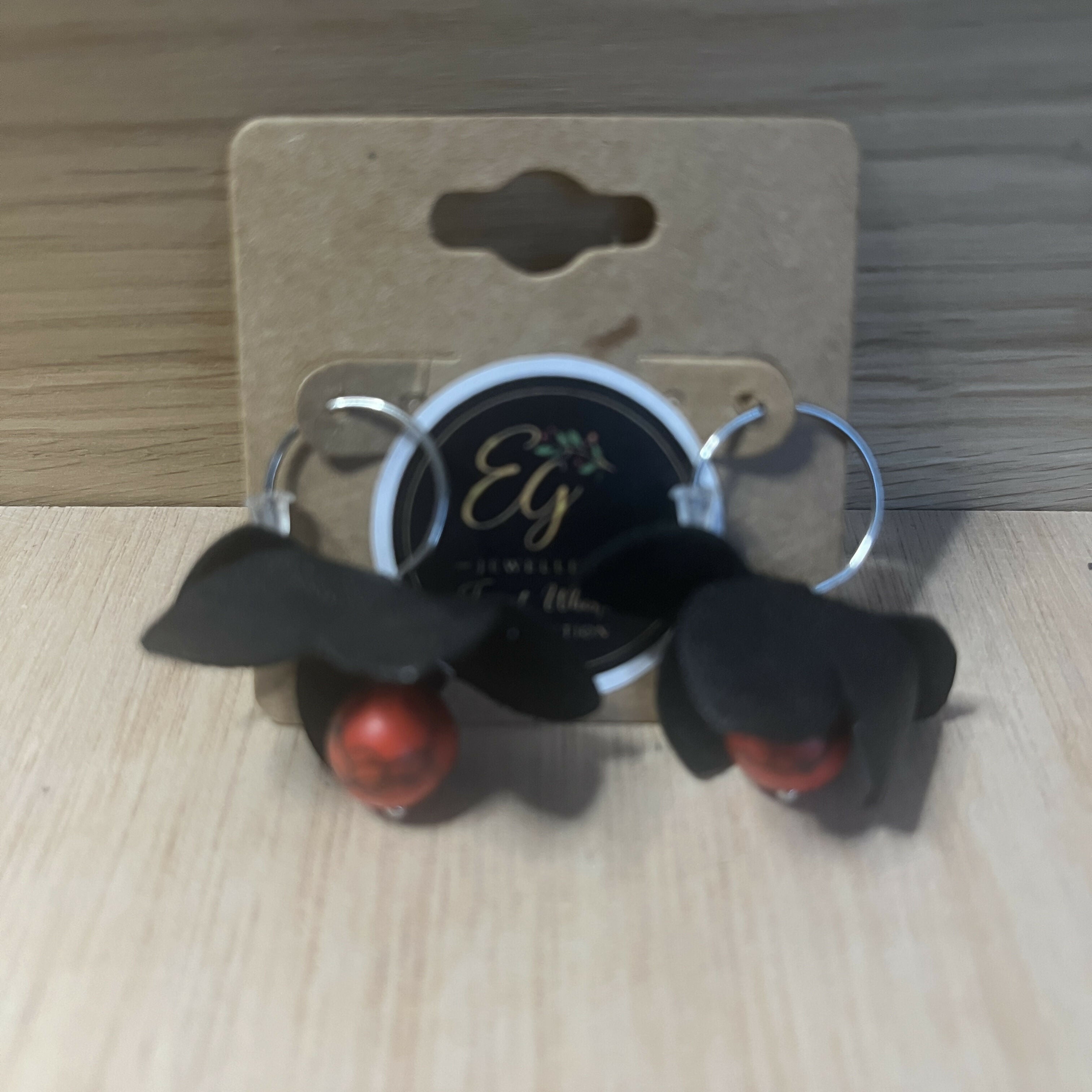 Forest Whisper – Black Leather Flower Earrings with Red Stone