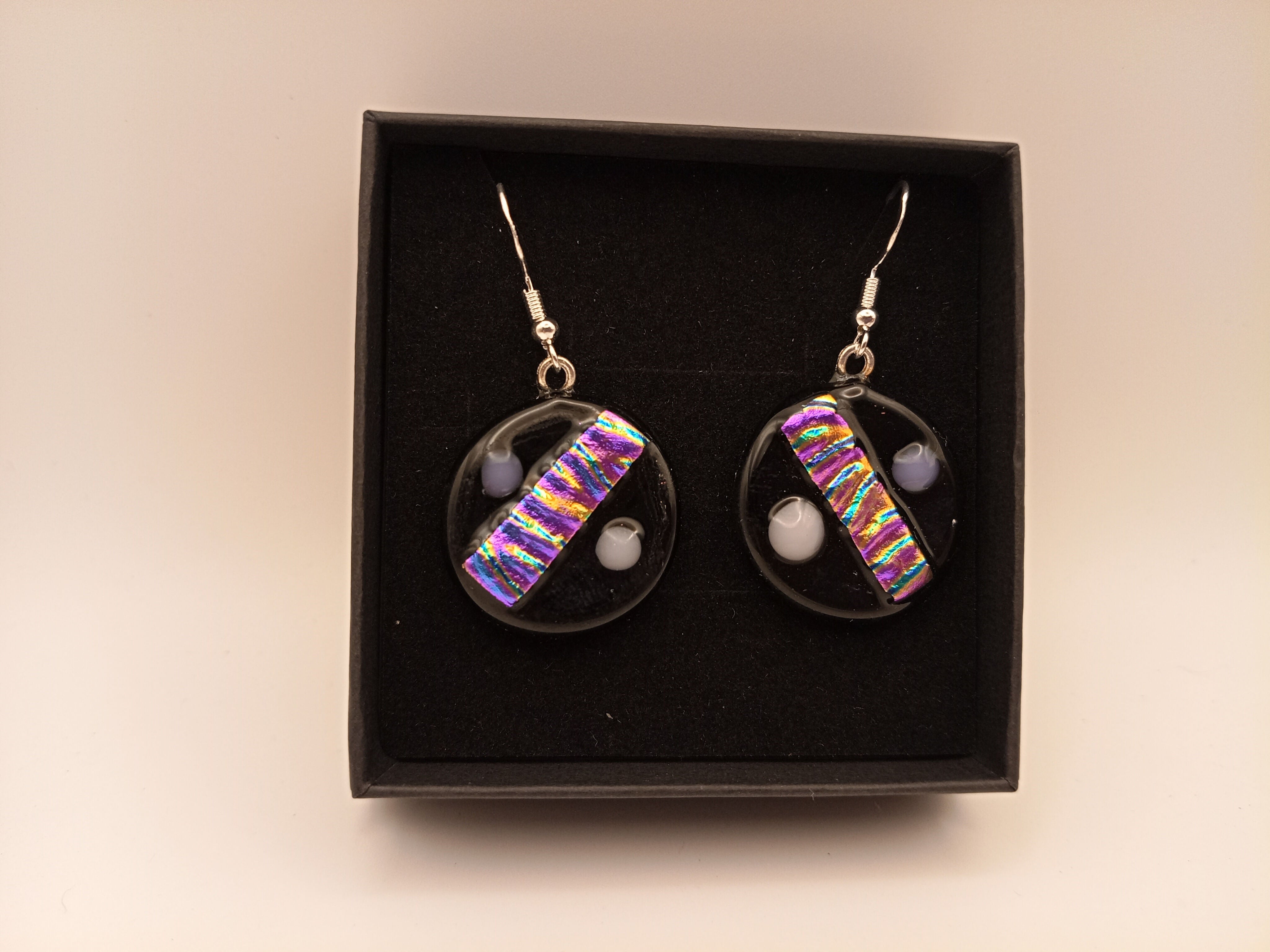 Pink, Purple and Gold Rippled Dichroic on Black Circle Earrings