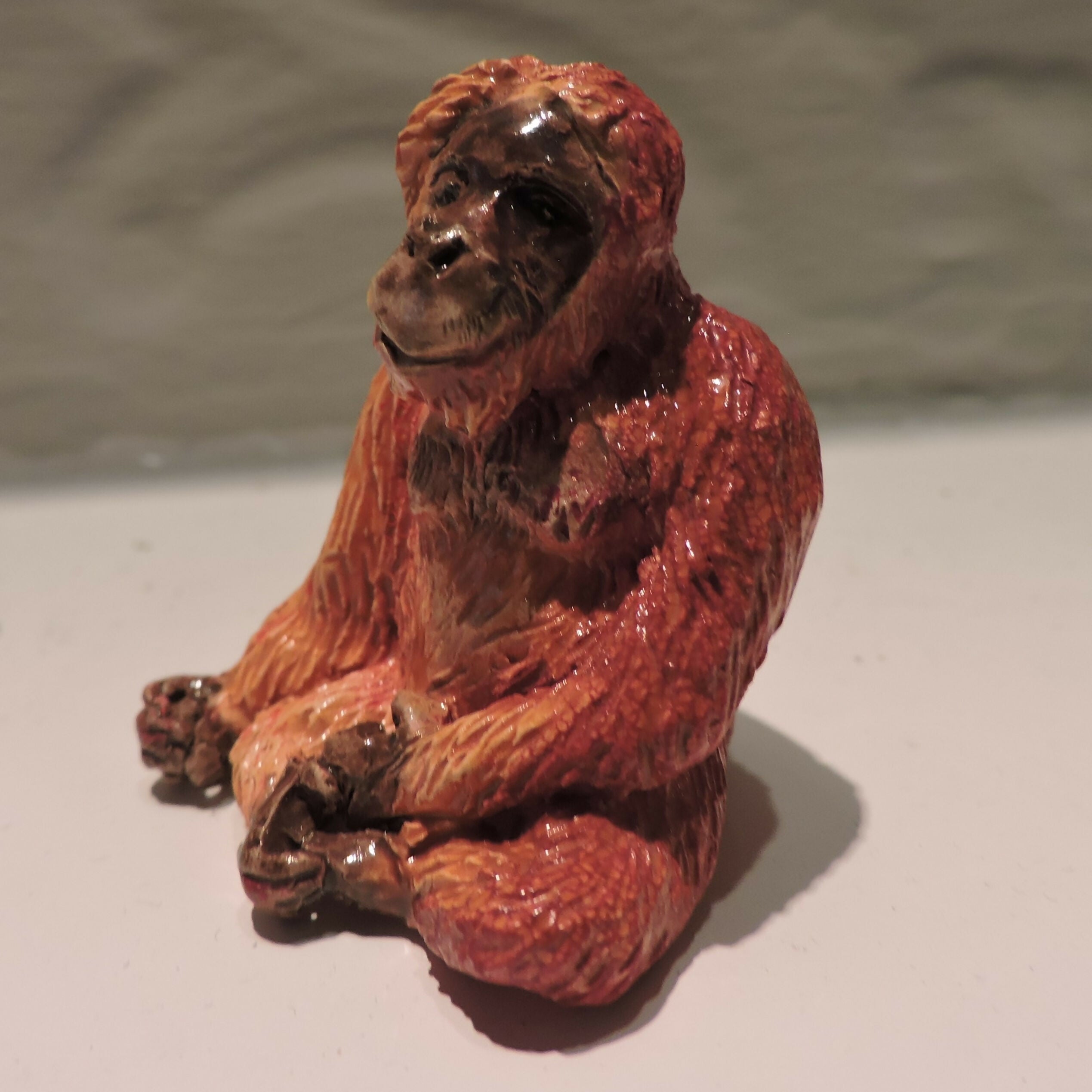 Ceramic orangutan sculpture