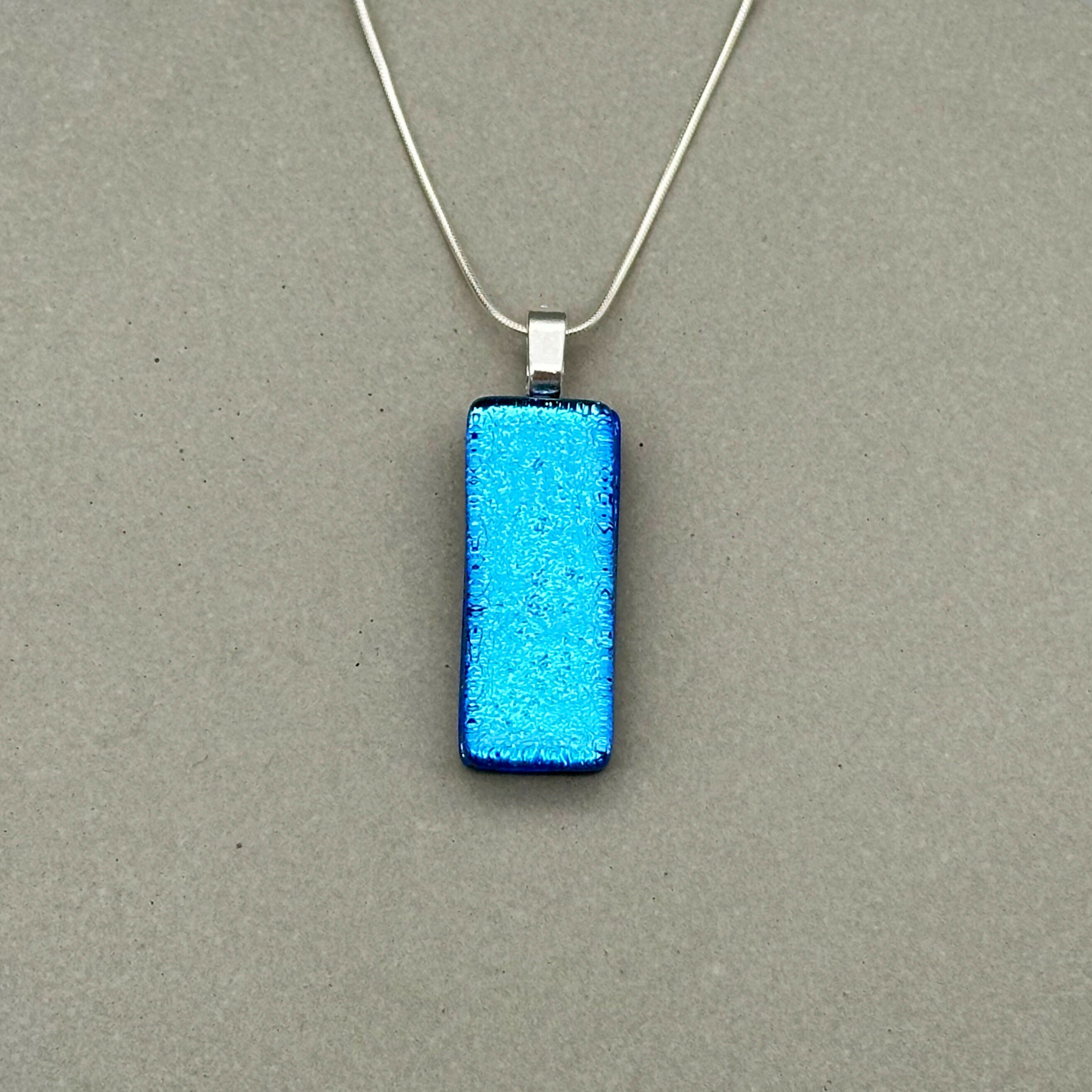 Light Blue Dichroic Fused Glass Pendant with Silver Plated Chain - Handmade by Jade Tapson Glass.