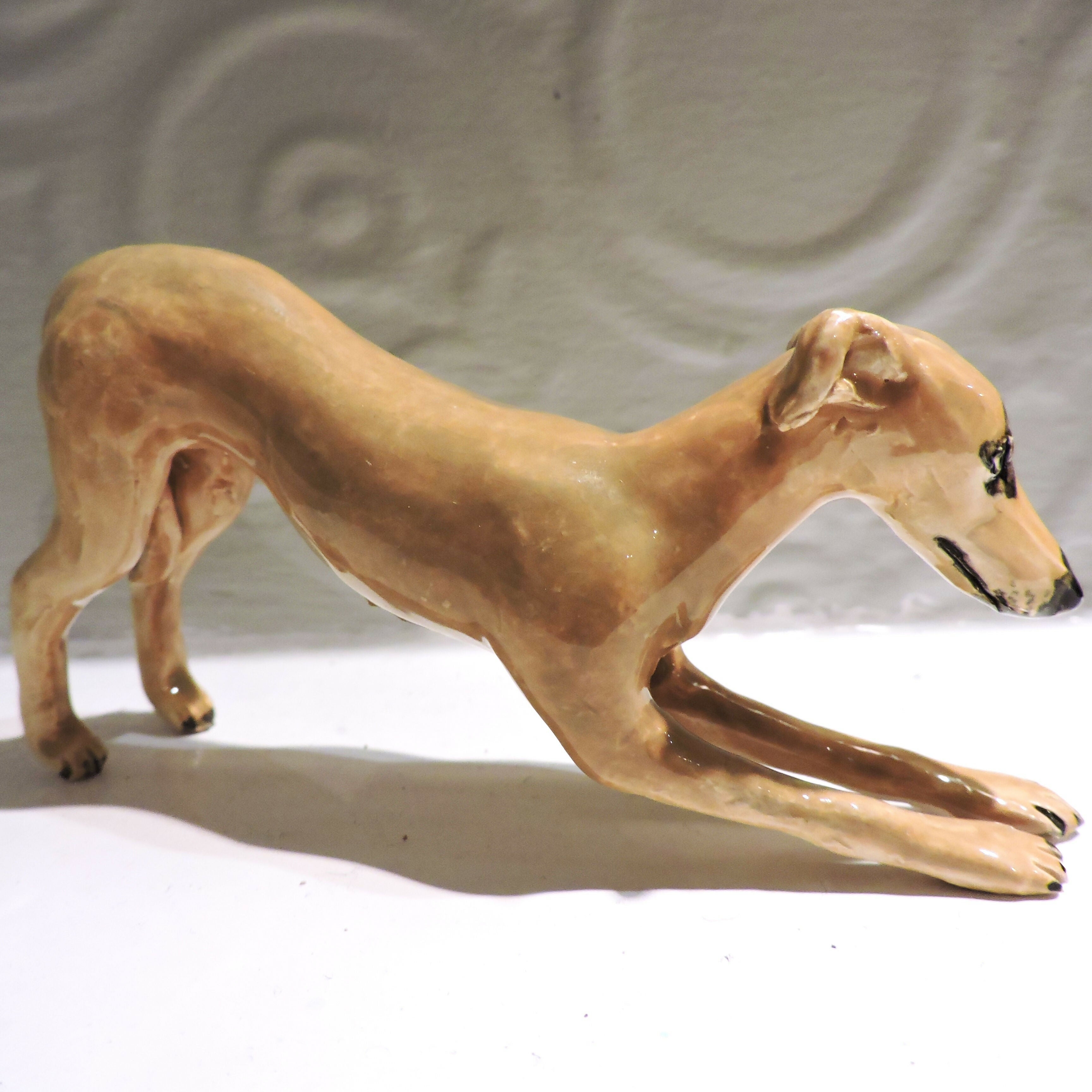 Ceramic Stretching whippet dog sculpture, fawn