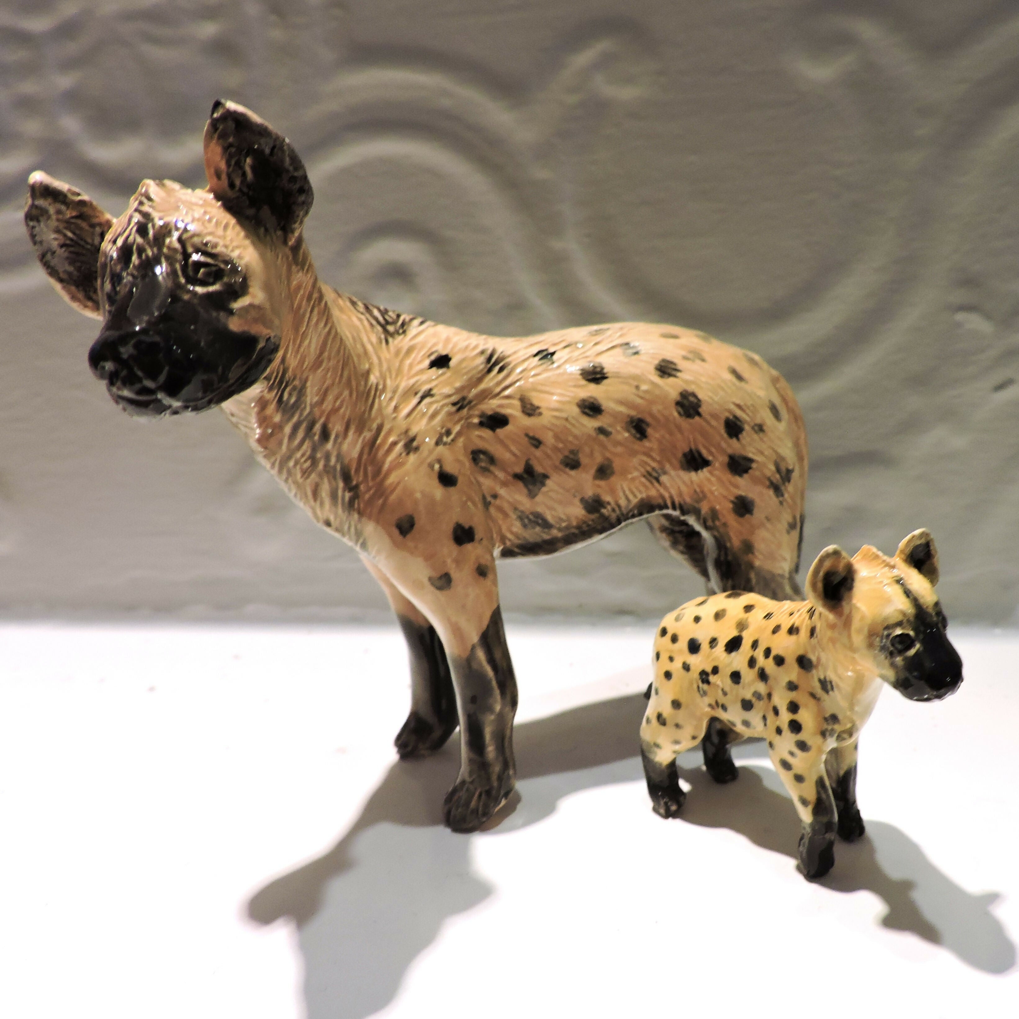 Ceramic spotted hyena sculpture