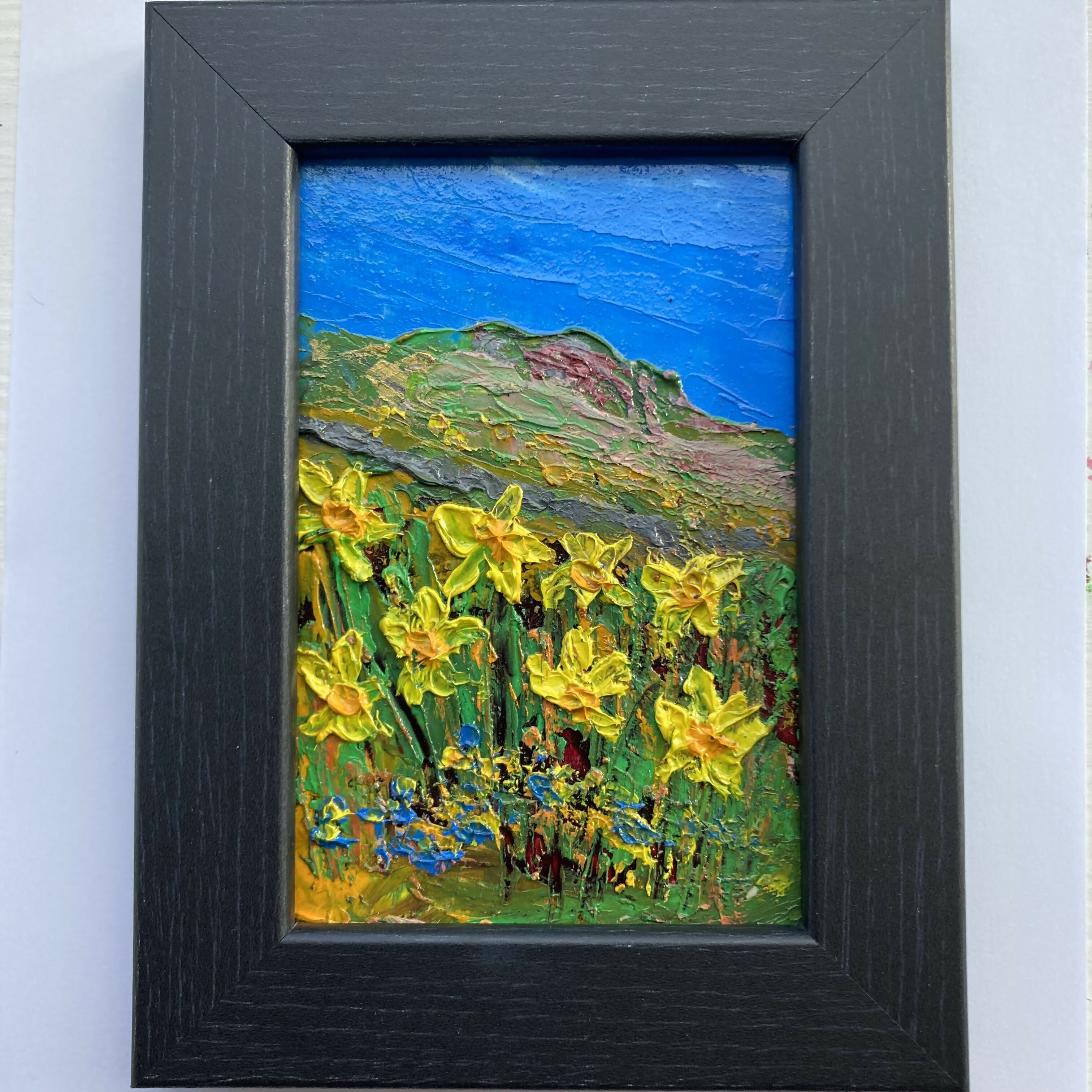 Daffodils & Forget Me Nots - Black Framed Oil Painting On Wood