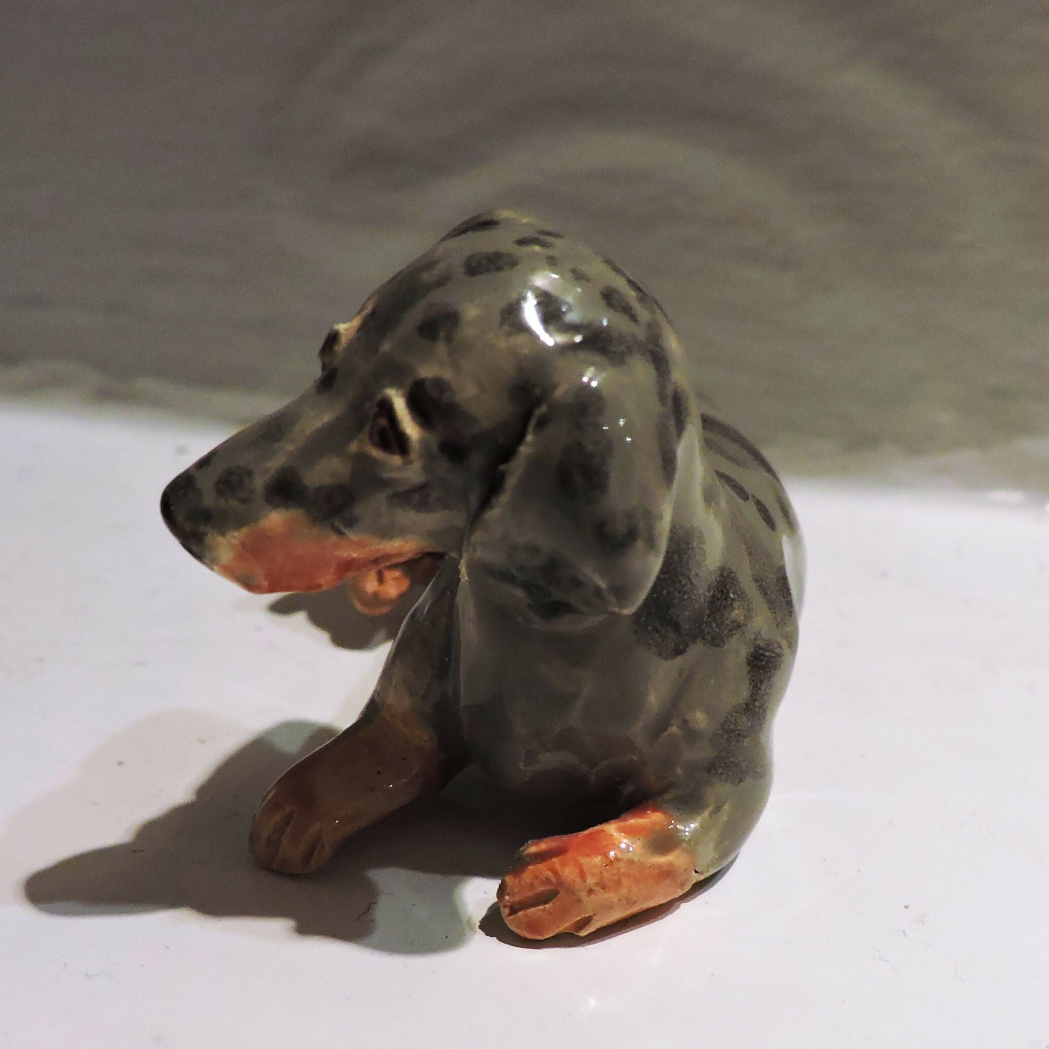 Ceramic silver dapple dachshund sculpture