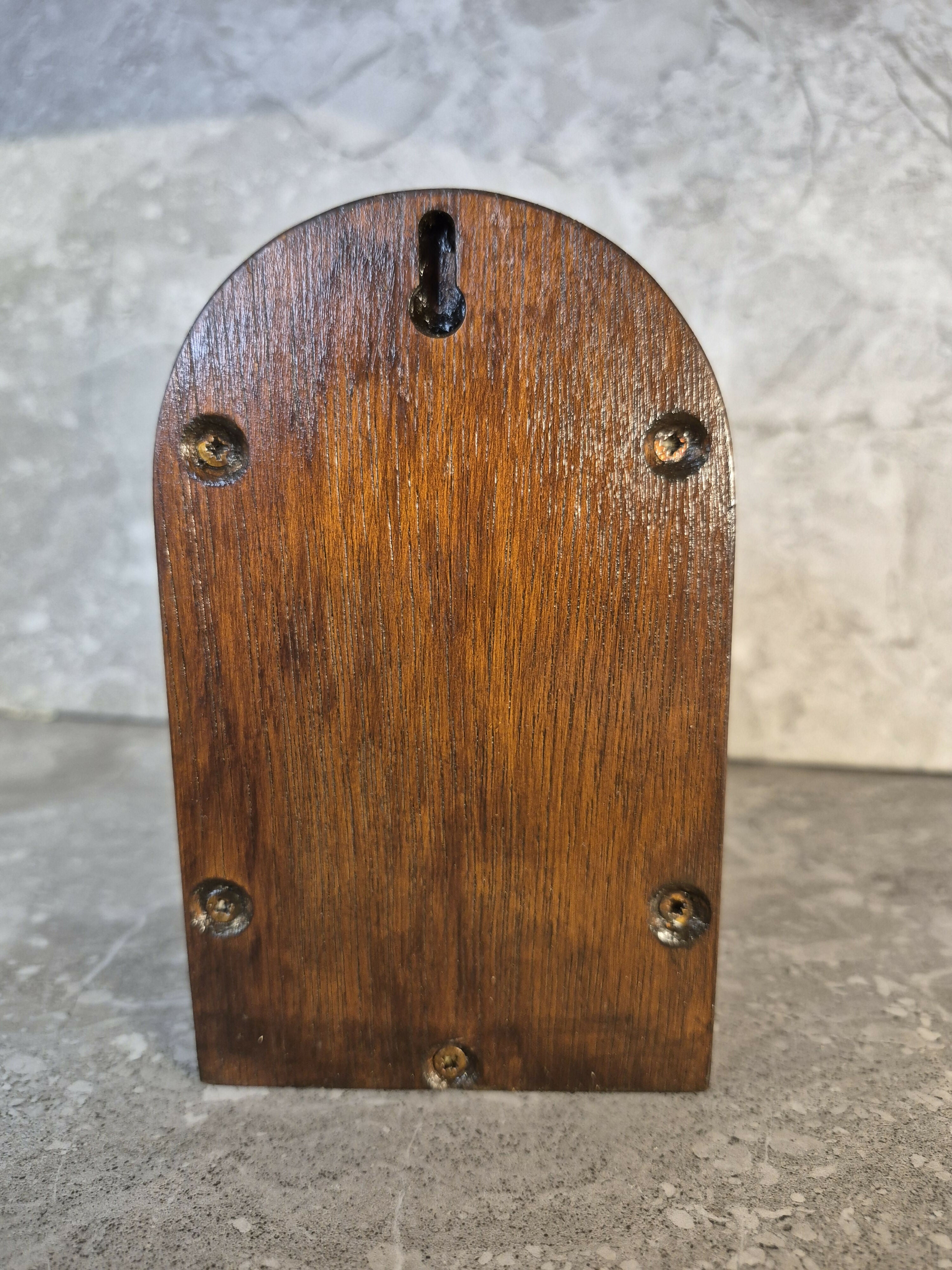 Handcrafted round arch opening wooden fairy door.