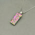 Pink Raindrop Dichroic Fused Glass Pendant with Silver Plated Chain - Handmade by Jade Tapson Glass.