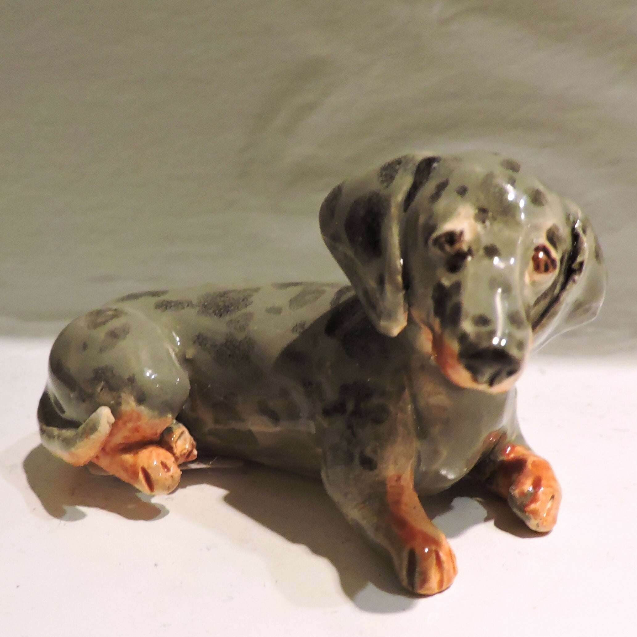Ceramic silver dapple dachshund sculpture