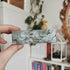 Grey roll on perfume box.