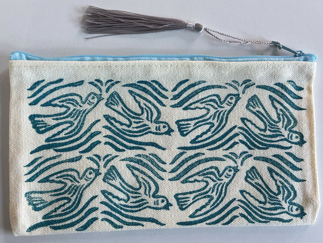 Hand printed Zip Pouch with Blue Flying Bird Design.