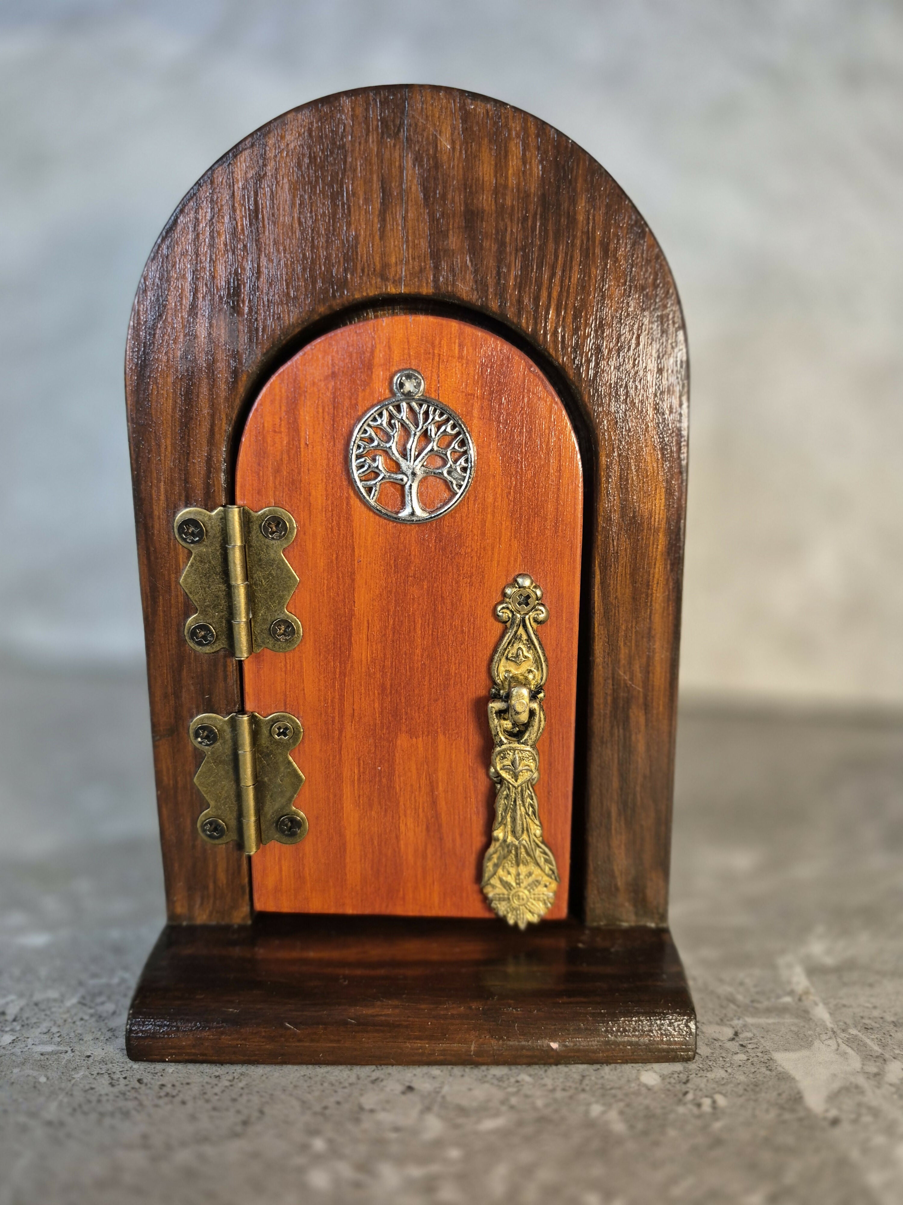 Handcrafted round arch wooden fairy door.