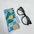 Blue glasses case pouch with lemons on.