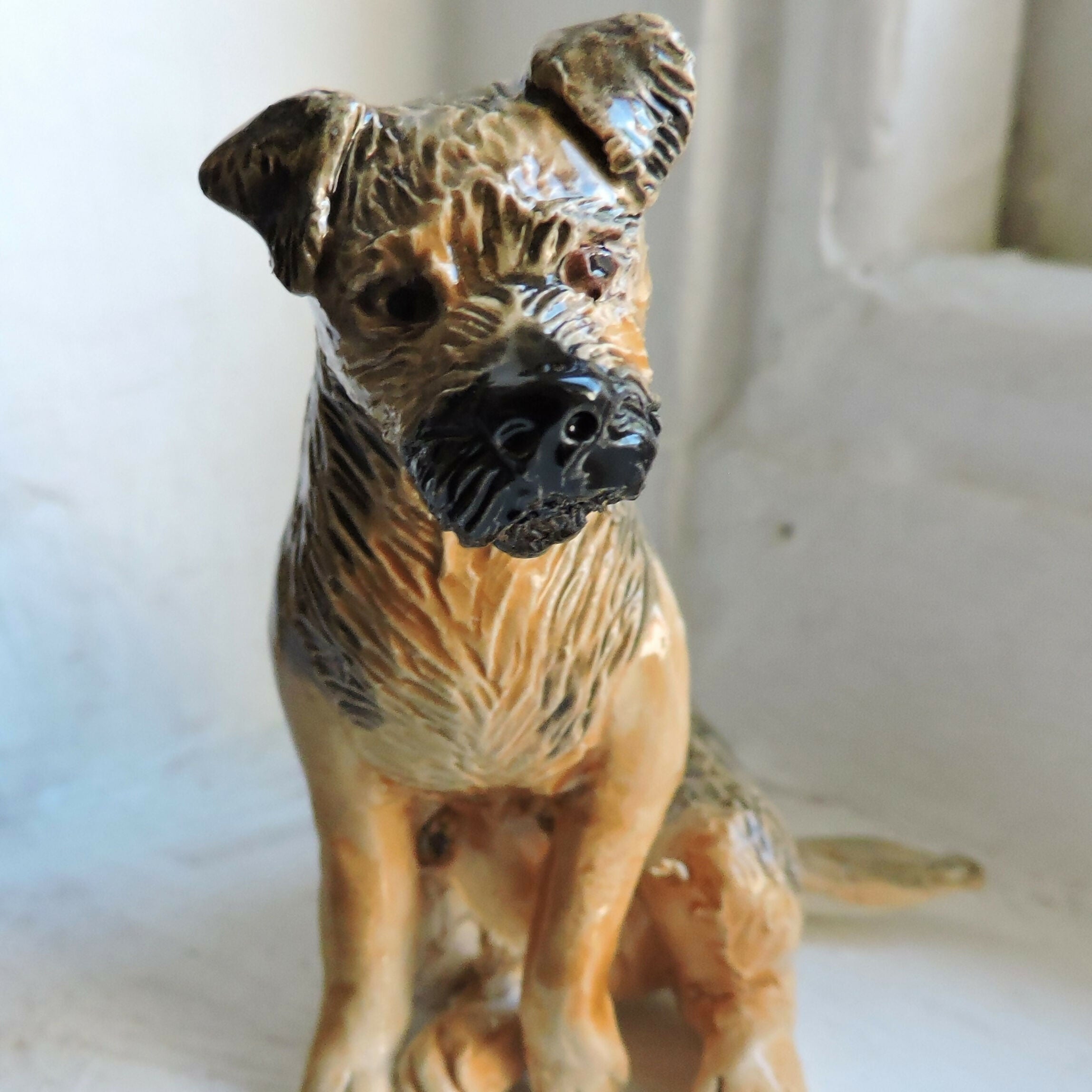Ceramic Border Terrier dog sculpture