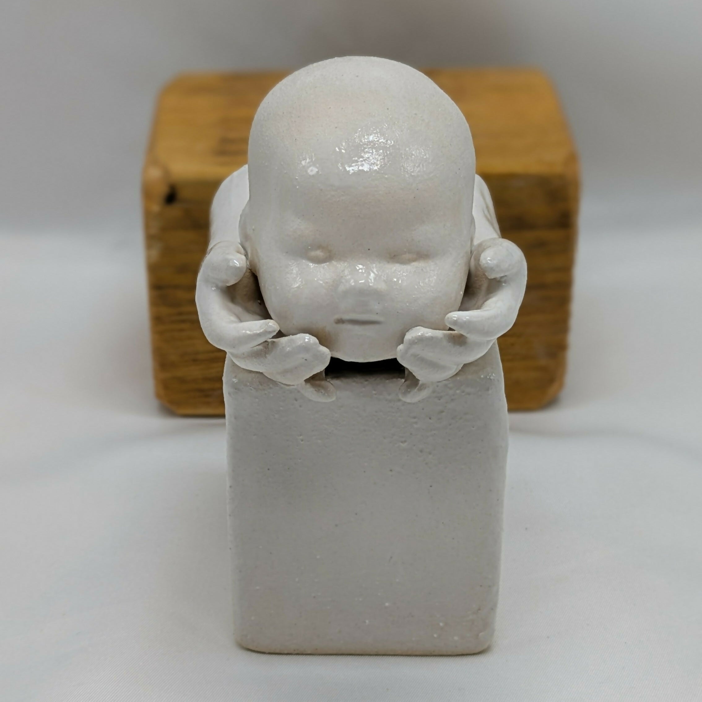 Balance Dolls Head in Hands Ceramic Sculpture
