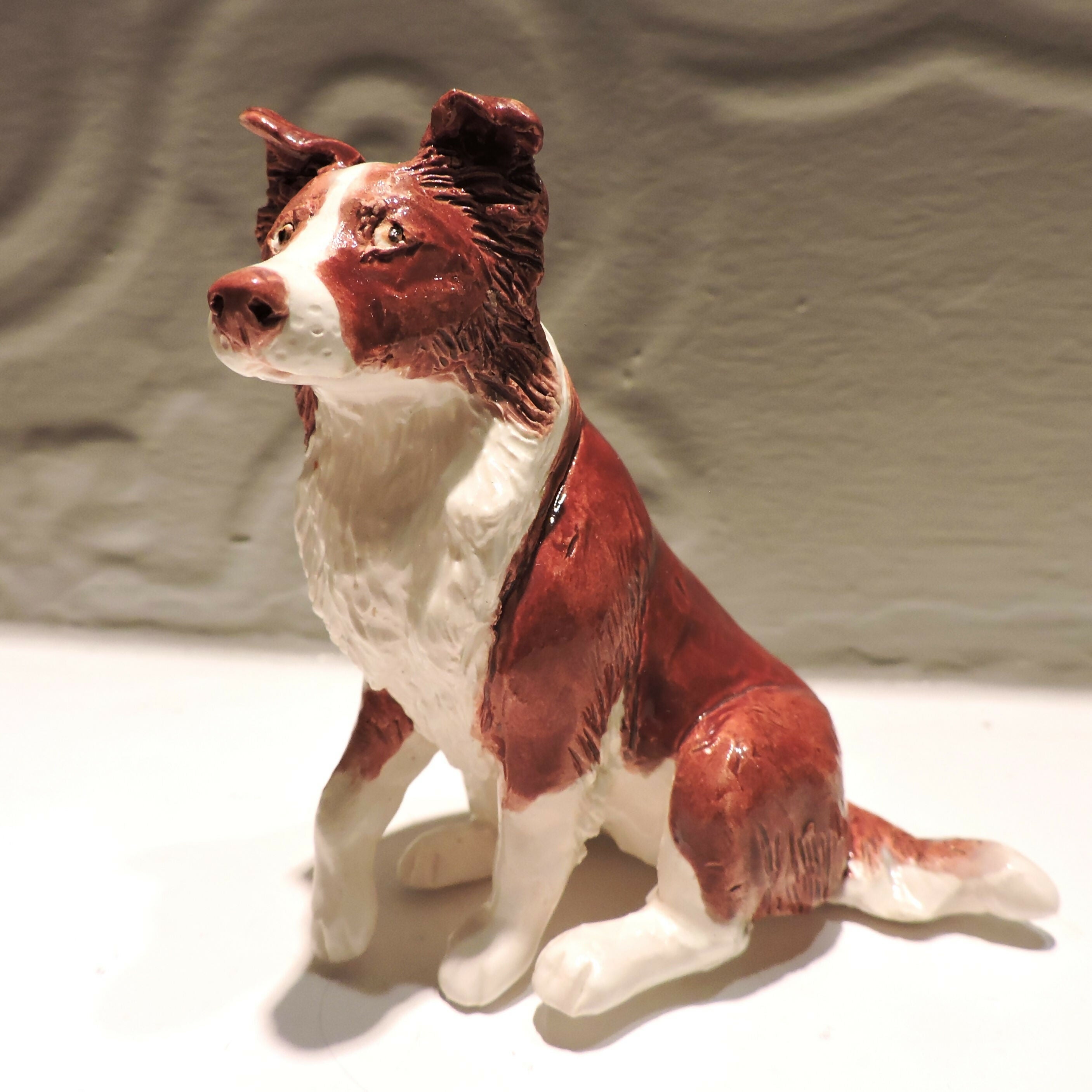 Ceramic border collie dog sculpture, red