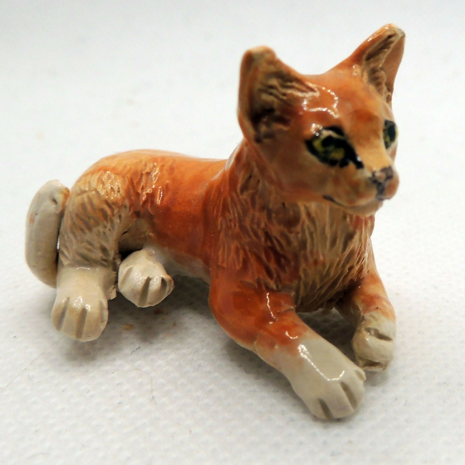 Ceramic ginger cat sculpture