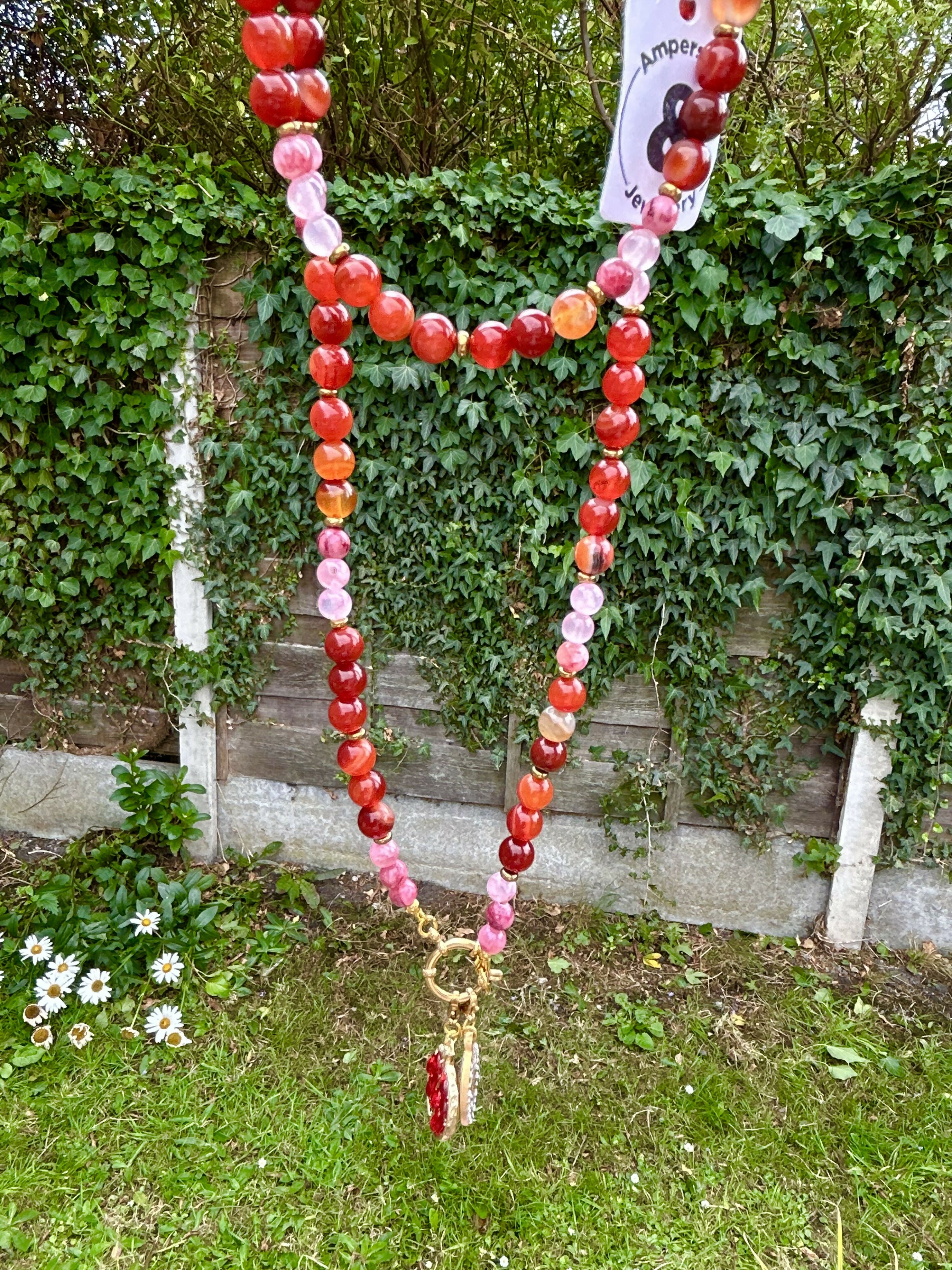 Extra long natural stone and hematite charm necklace