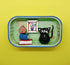 Black Cat with Books and Picture in a Tin