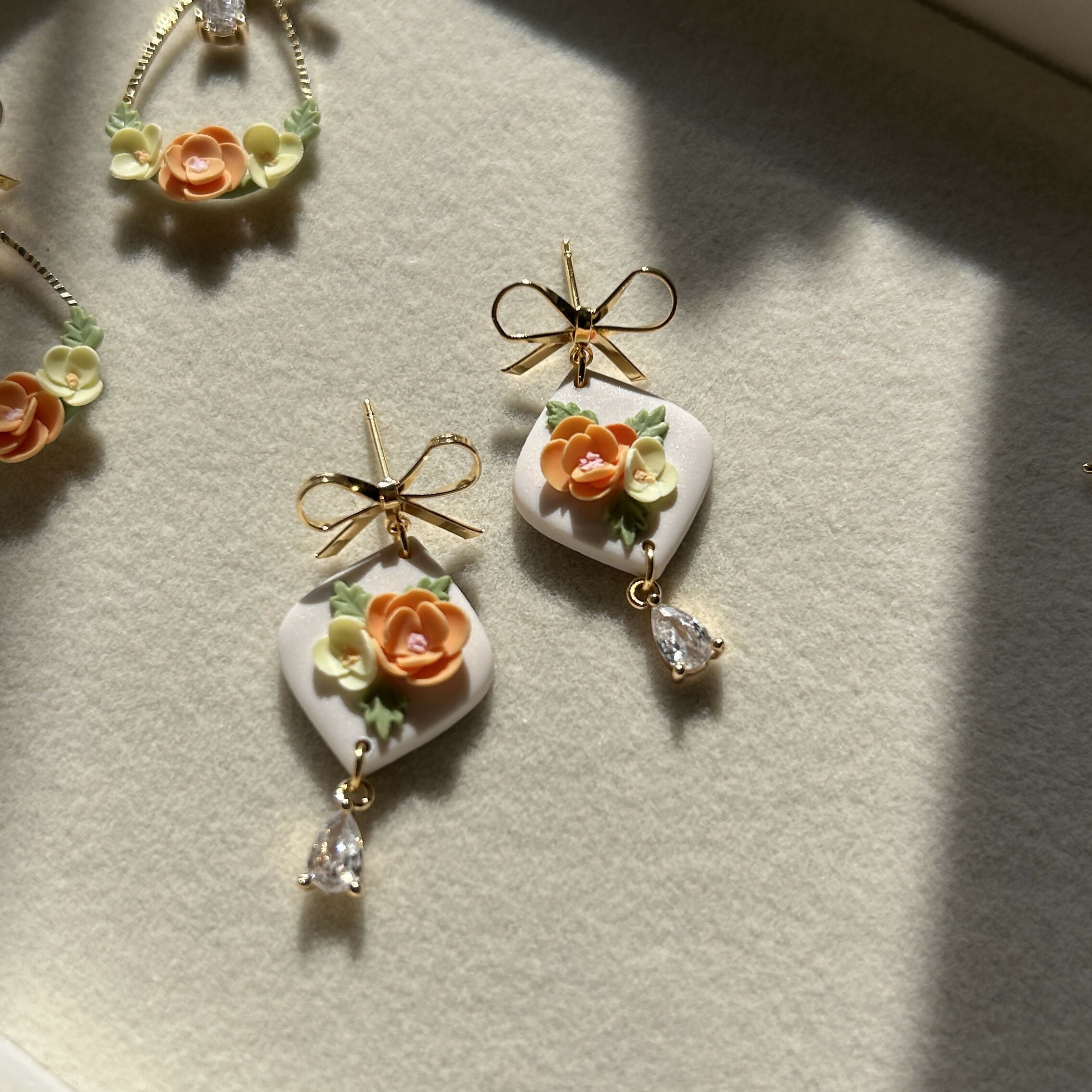 Orange and yellow floral Earrings on bow