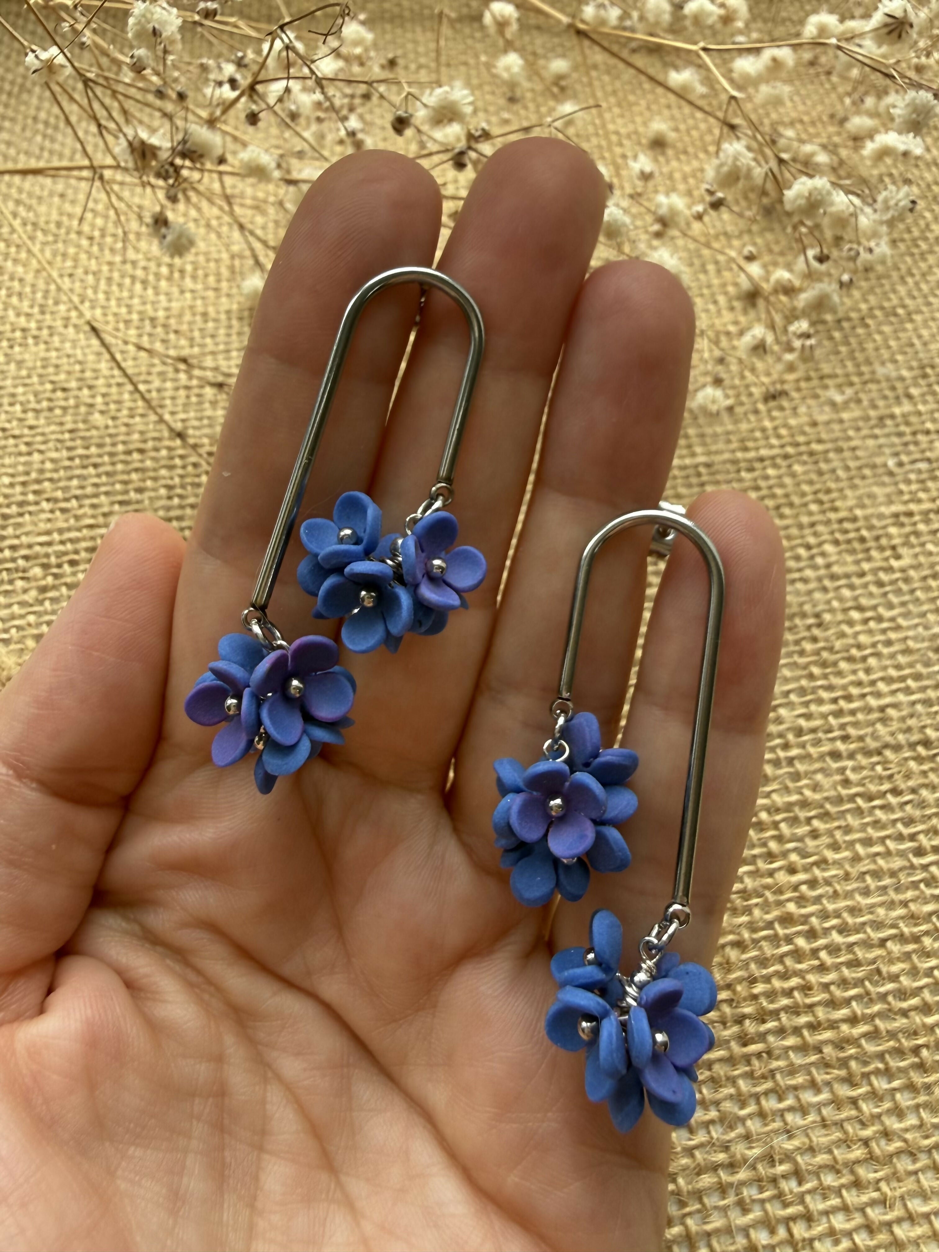Long Arc Drop Earrings with Blue Flower Cluster