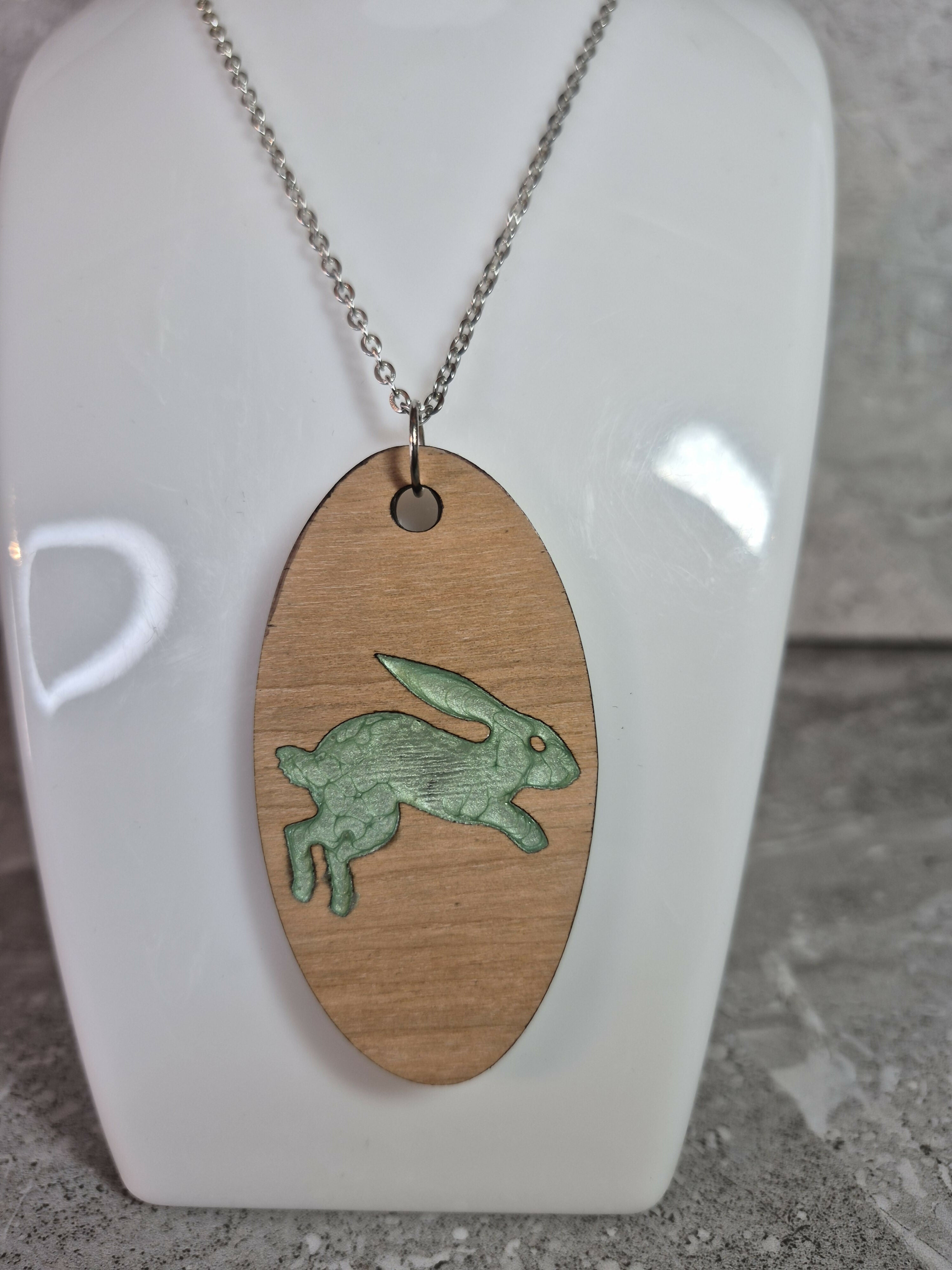 Unique Handcrafted Oval Cherry Wood Veneered Pendant With Engraved Leaping Hare