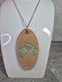 Unique Handcrafted Oval Cherry Wood Veneered Pendant With Engraved Leaping Hare