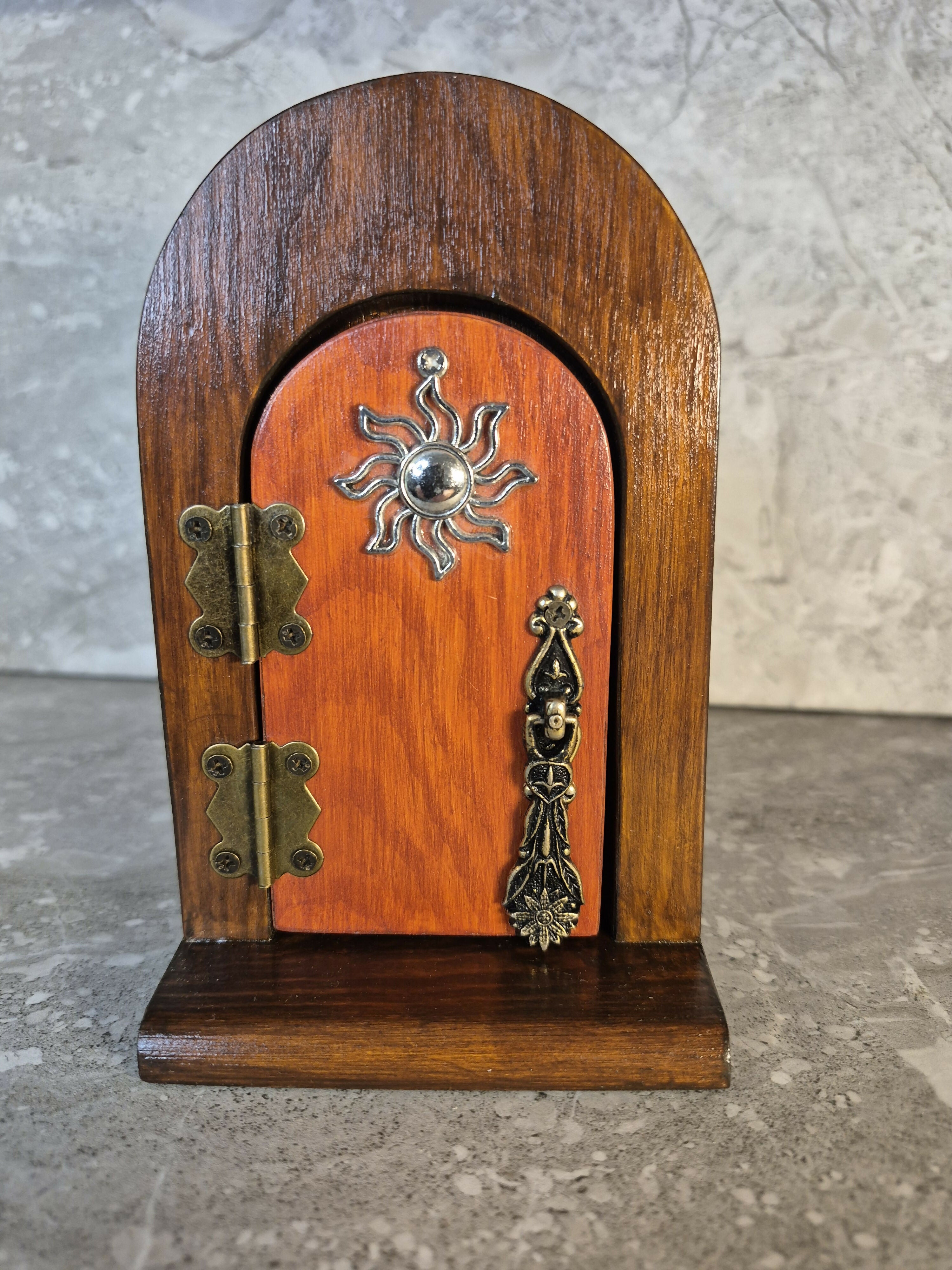 Handcrafted round arch opening wooden fairy door.