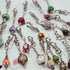 CHARMING GLASS BEADED BAG CHARM/KEYRING.