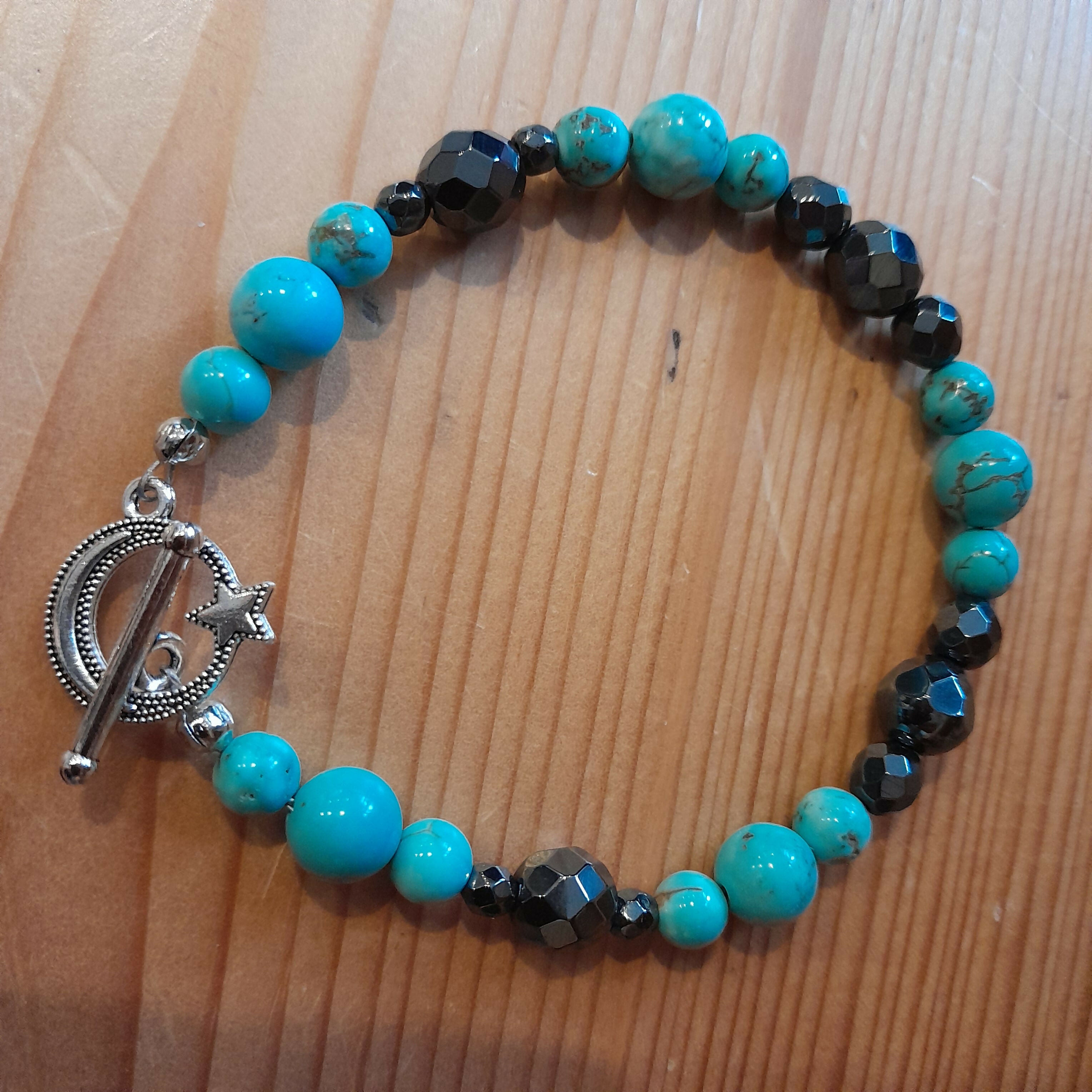 Tibetan Silver Toggle Catch Bracelet with Turquoise and Faceted Grey Hematite.