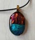 Fused Dichroic Glass Oval Pendant With a Cord Necklace (Red and Green)