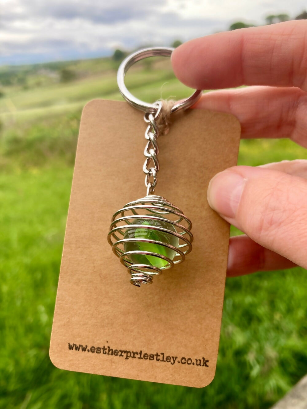 Glass Marble (Green) in Silver Plated Wire Cage on keyring