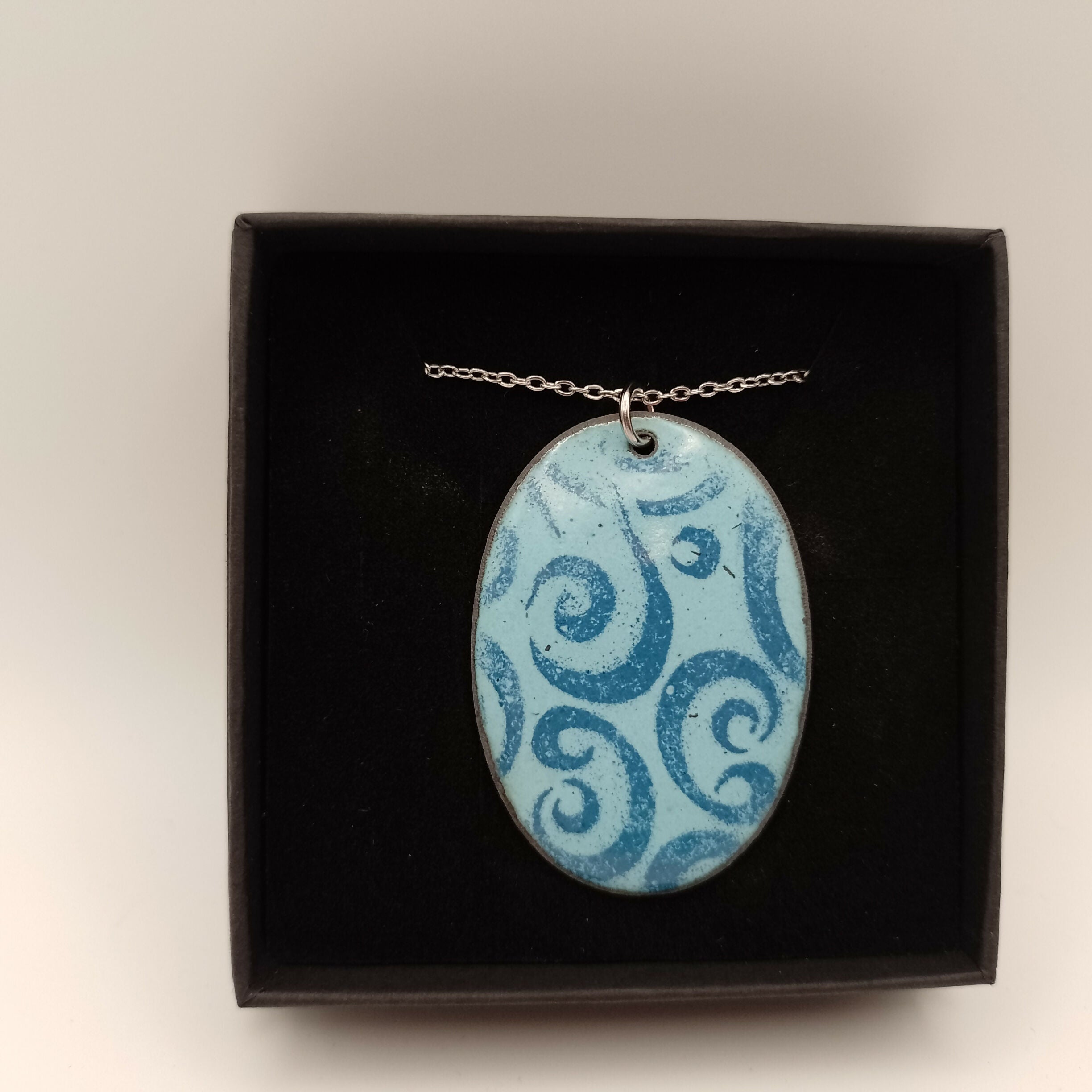 Pale Blue Enamel Pendant with Dark Blue Swirl Pattern
