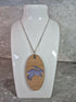 Unique Handcrafted Oval Pendant With An Engraved Leaping Hare