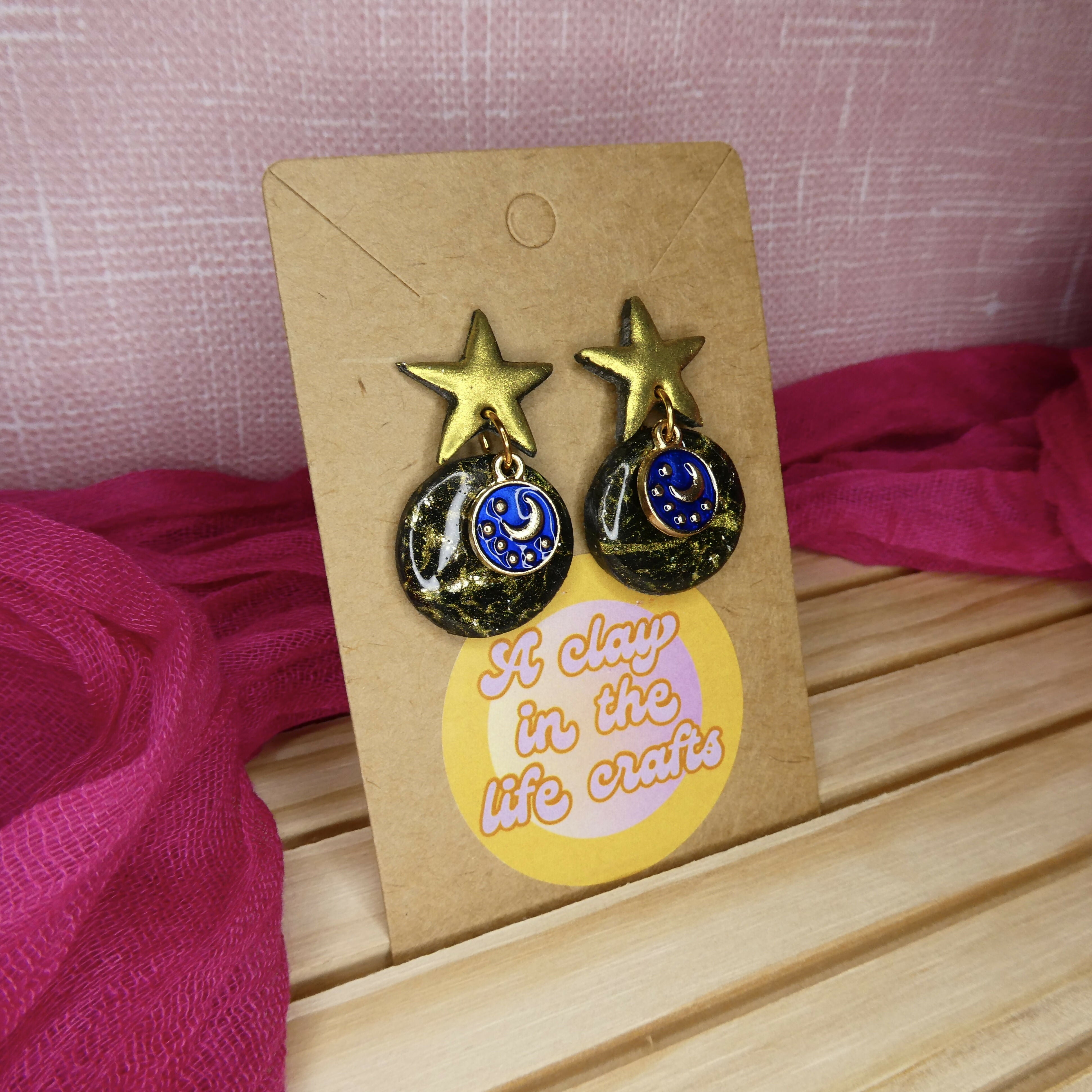 Black And Gold Shimmery Star Earrings With Blue Night Sky Charm
