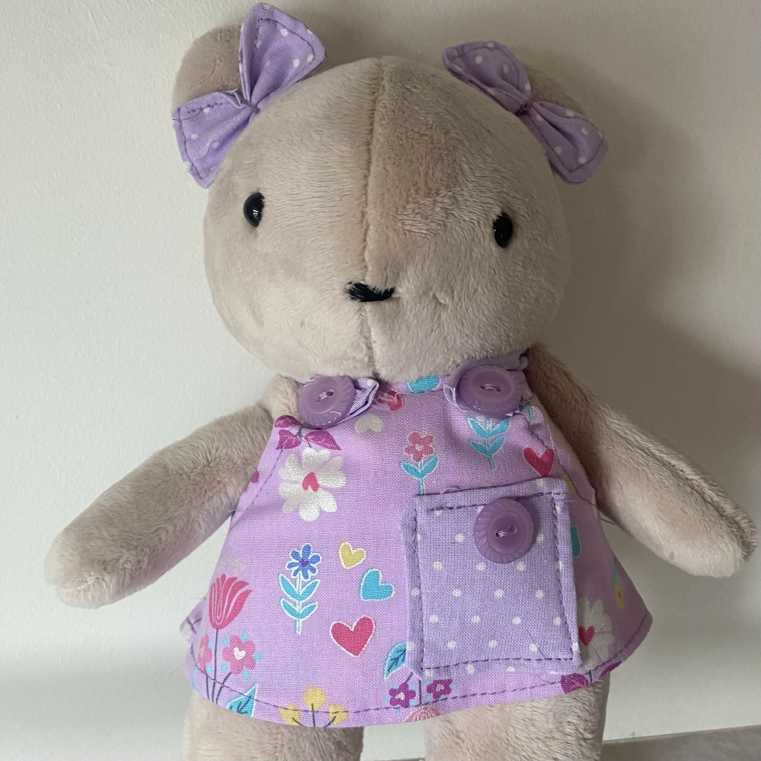 Teddy in a lilac flower dress