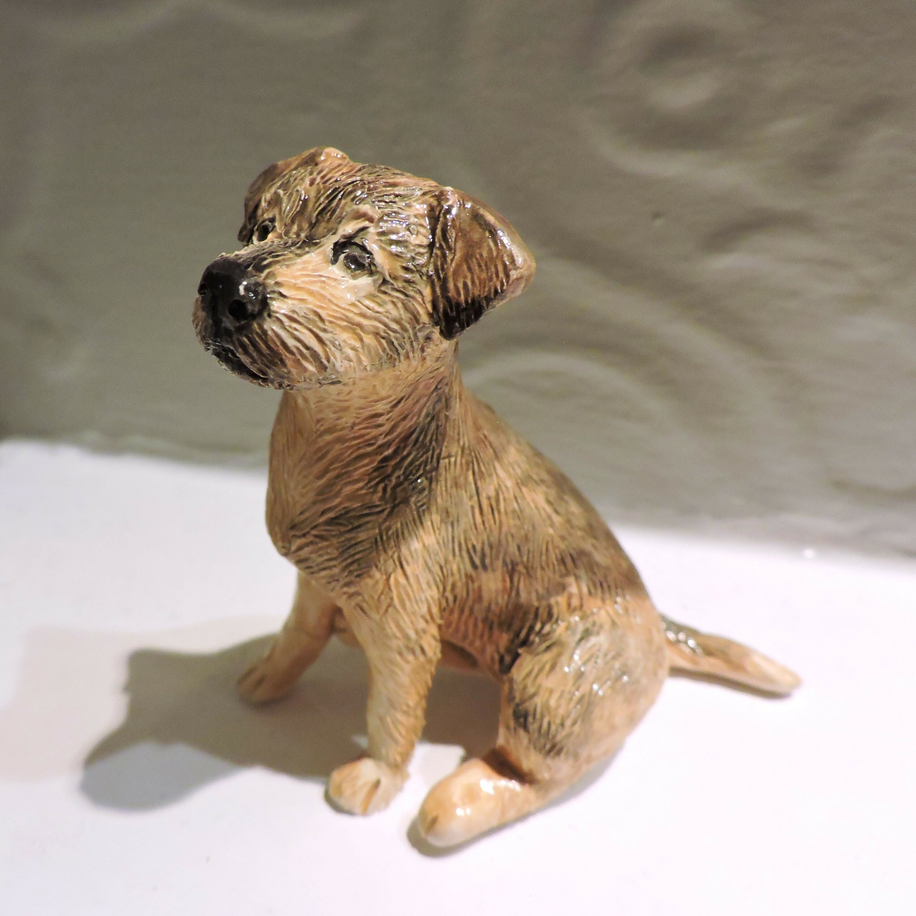 Ceramic border terrier dog sculpture