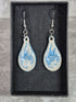 Handcrafted teardrop ivory and cyan colour earrings.