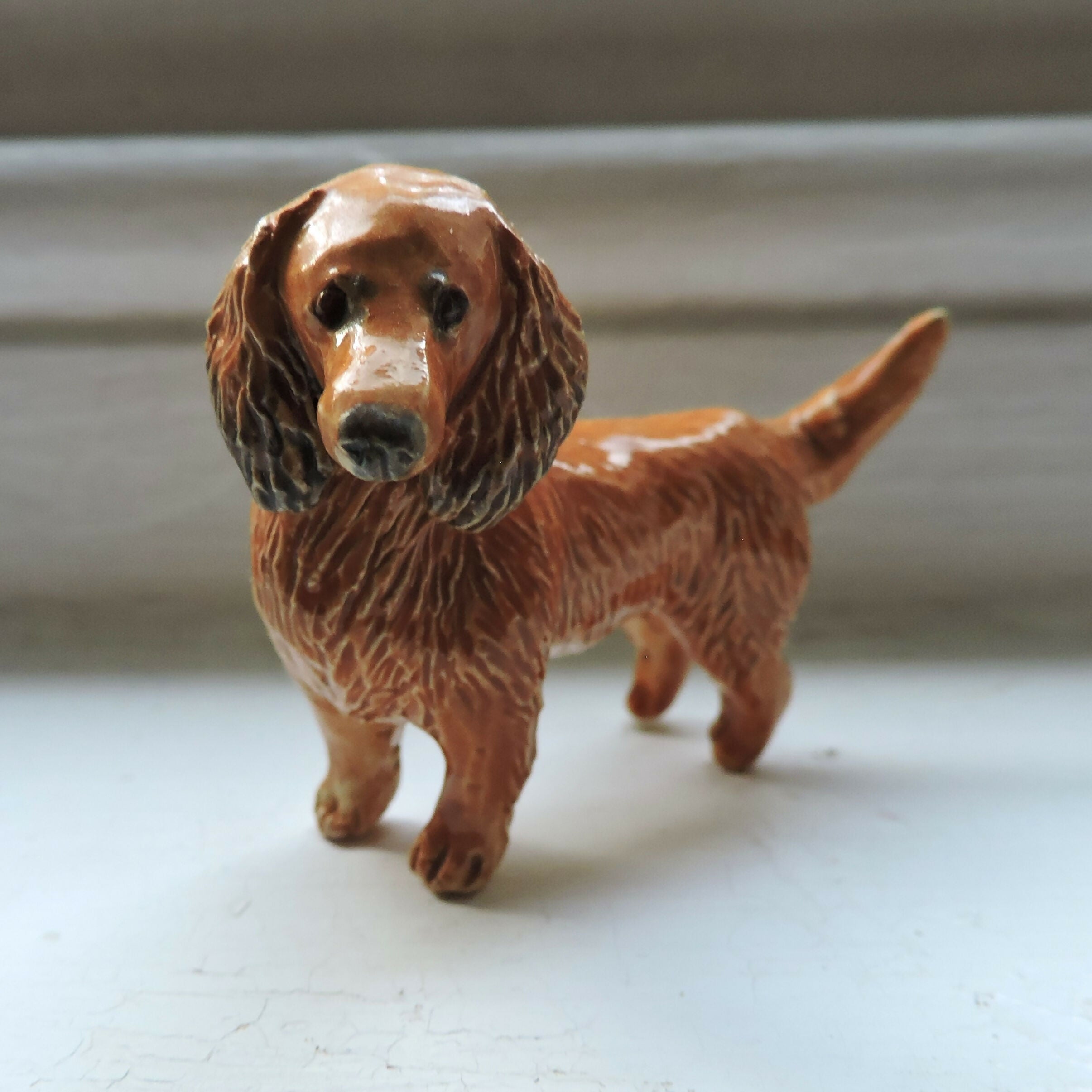 Ceramic Red Longhaired dachshund dog sculpture