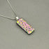 Pink Raindrop Dichroic Fused Glass Pendant with Silver Plated Chain - Handmade by Jade Tapson Glass.