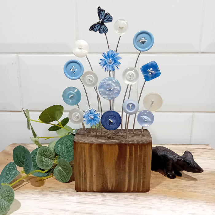 Blue button flower display