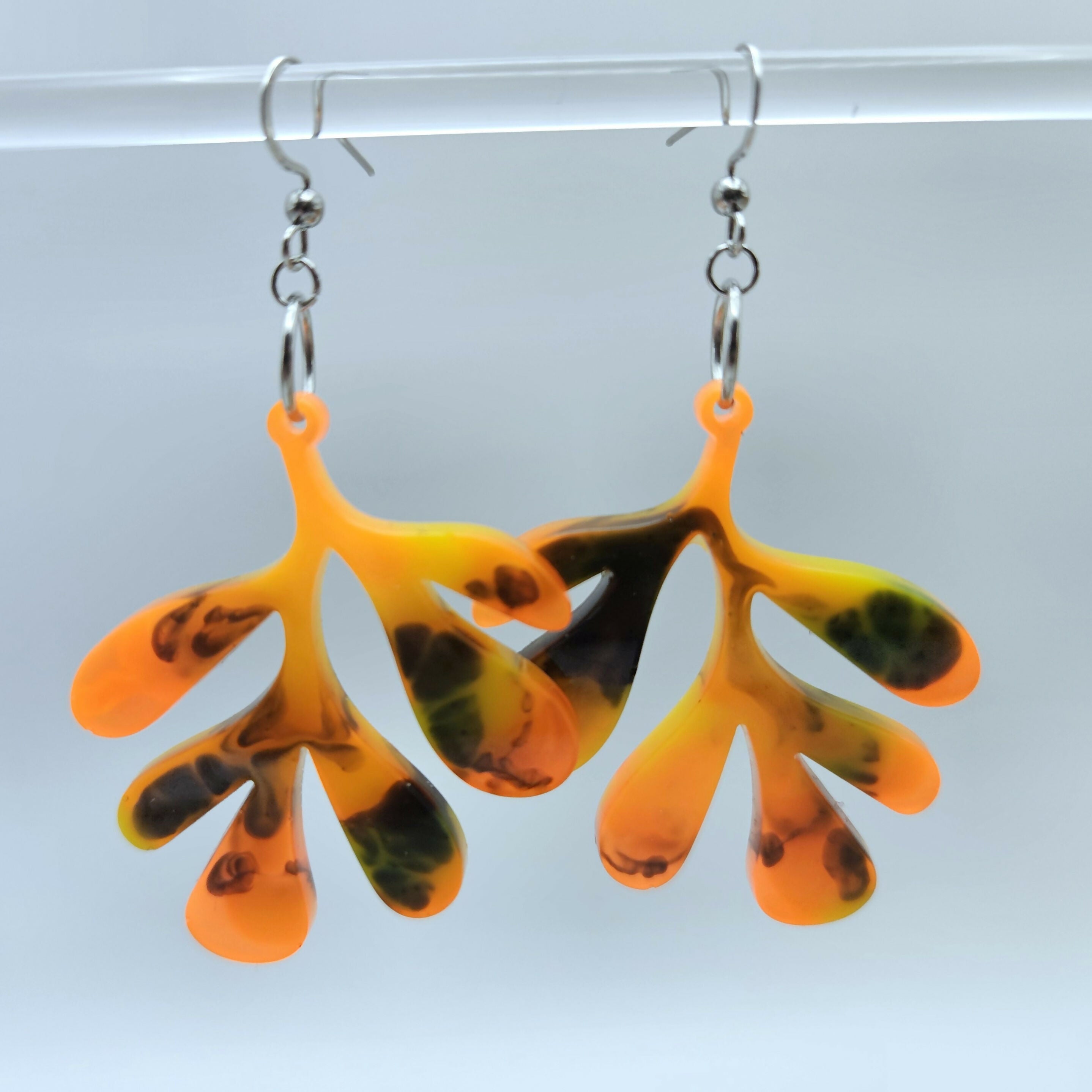 HANDMADE RESIN EARRINGS IN FUN, BOLD LEAF DESIGN.