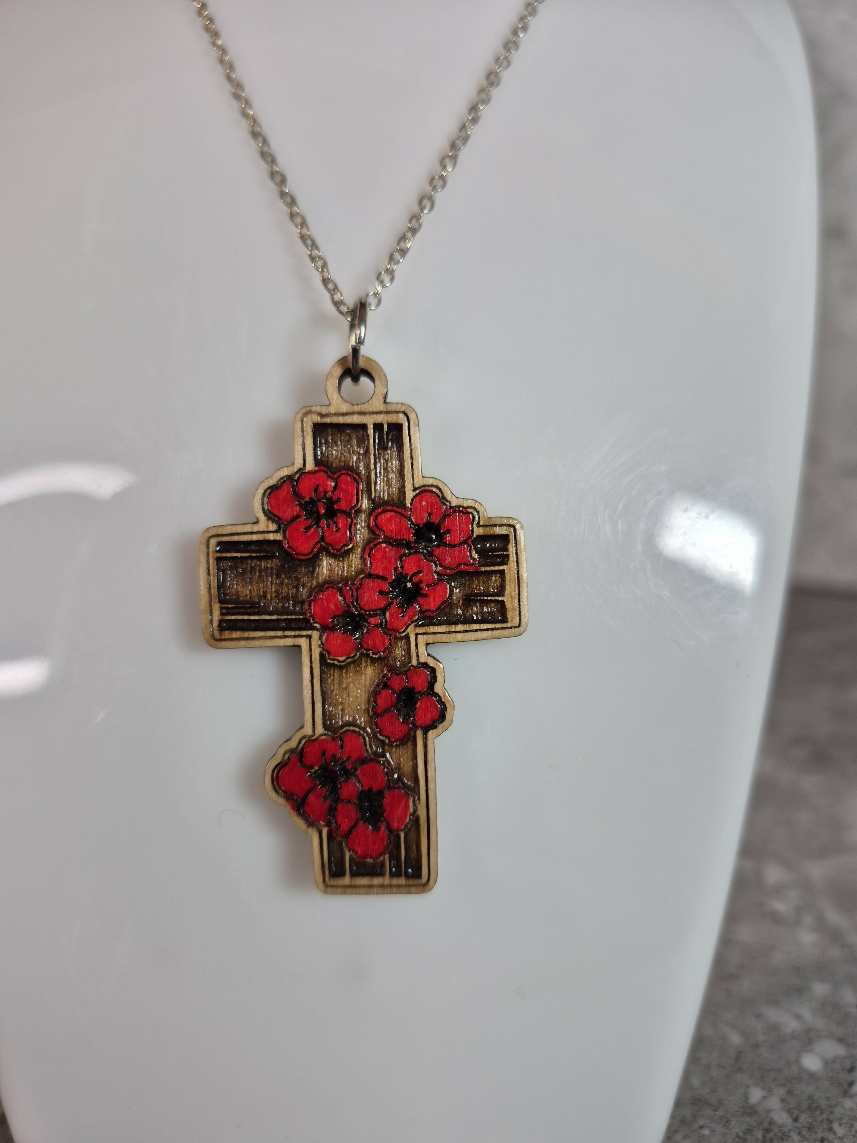 Handcrafted and engraved red poppy cross.