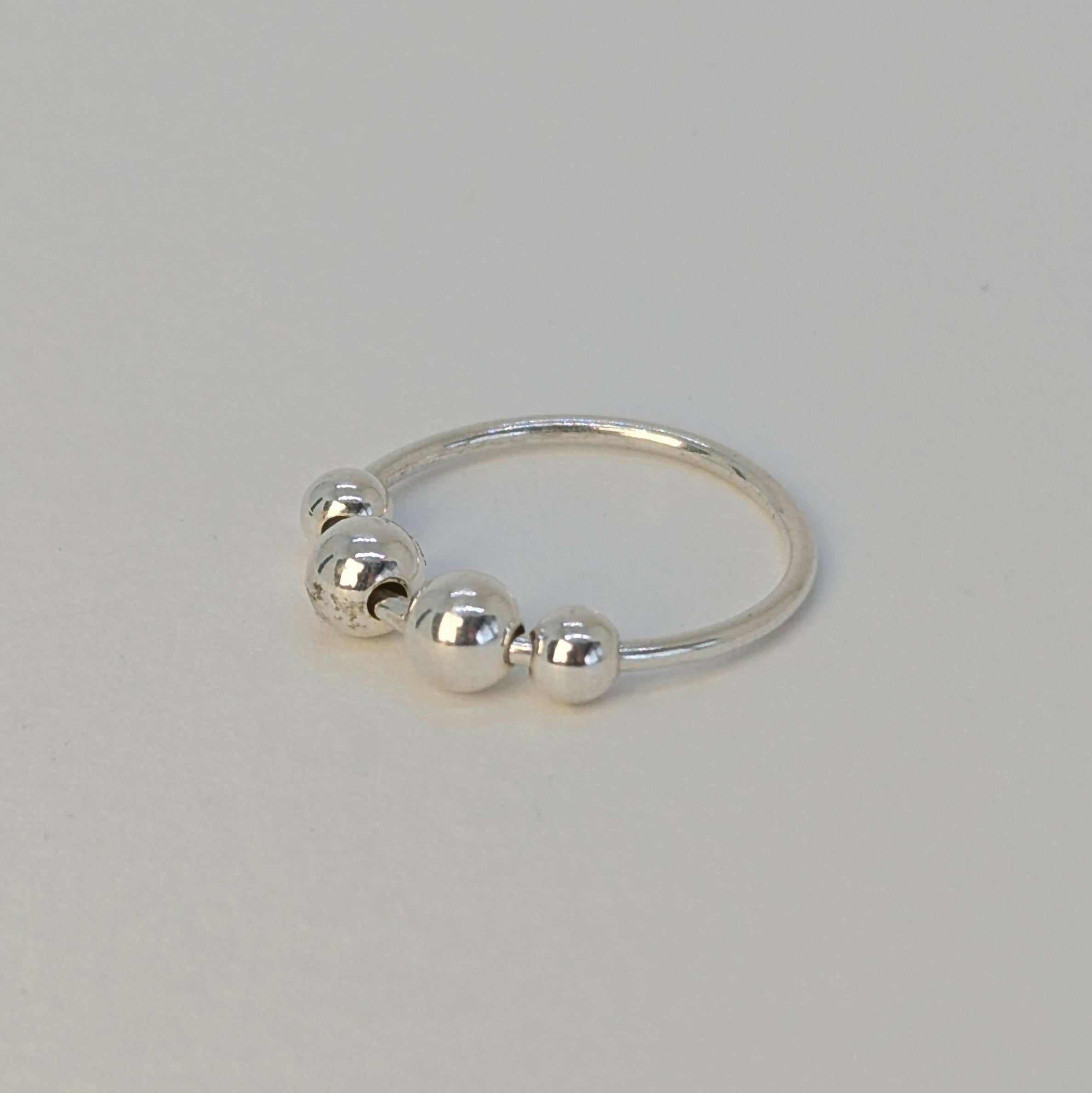 ‘Orbit’ Sterling Silver Polished Bead Fidget Ring