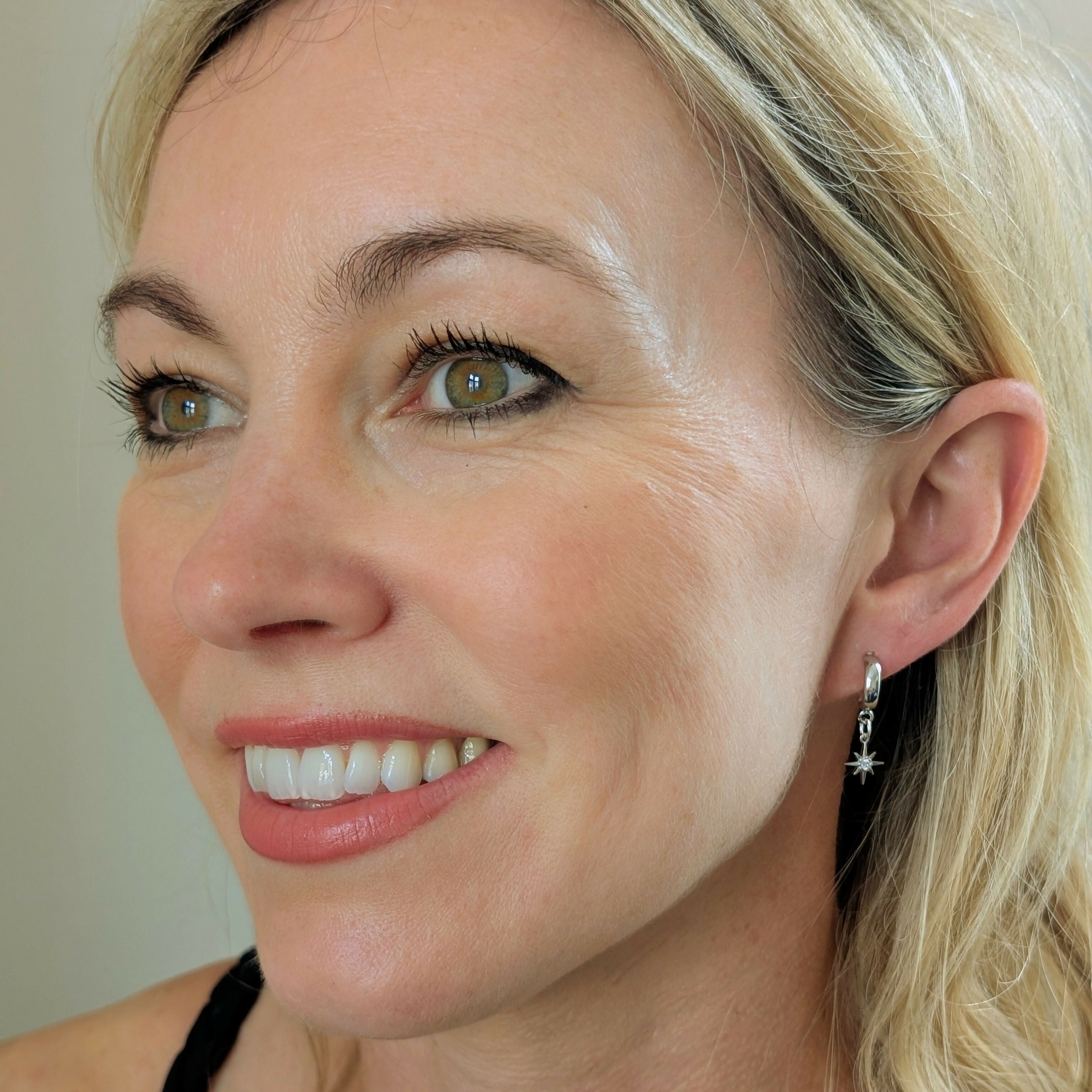 Tiny Silver Cubic Zirconia Star Earrings on a Silver Plated Half Loop Huggie Stud