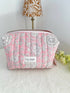 Pink Quilted Toiletry Bag with Zipper with white flower print