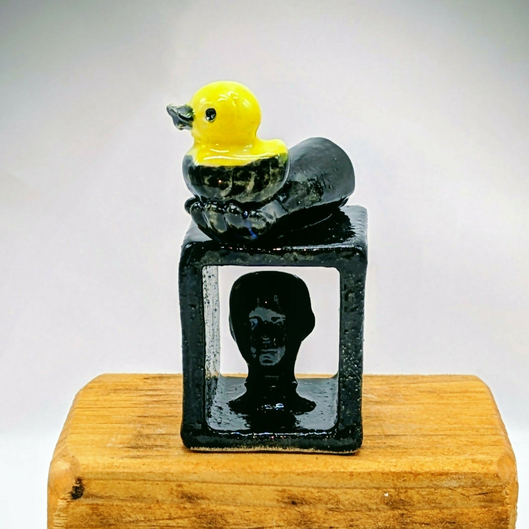 Balance - Small Black Head and Duckie Ceramic Sculpture
