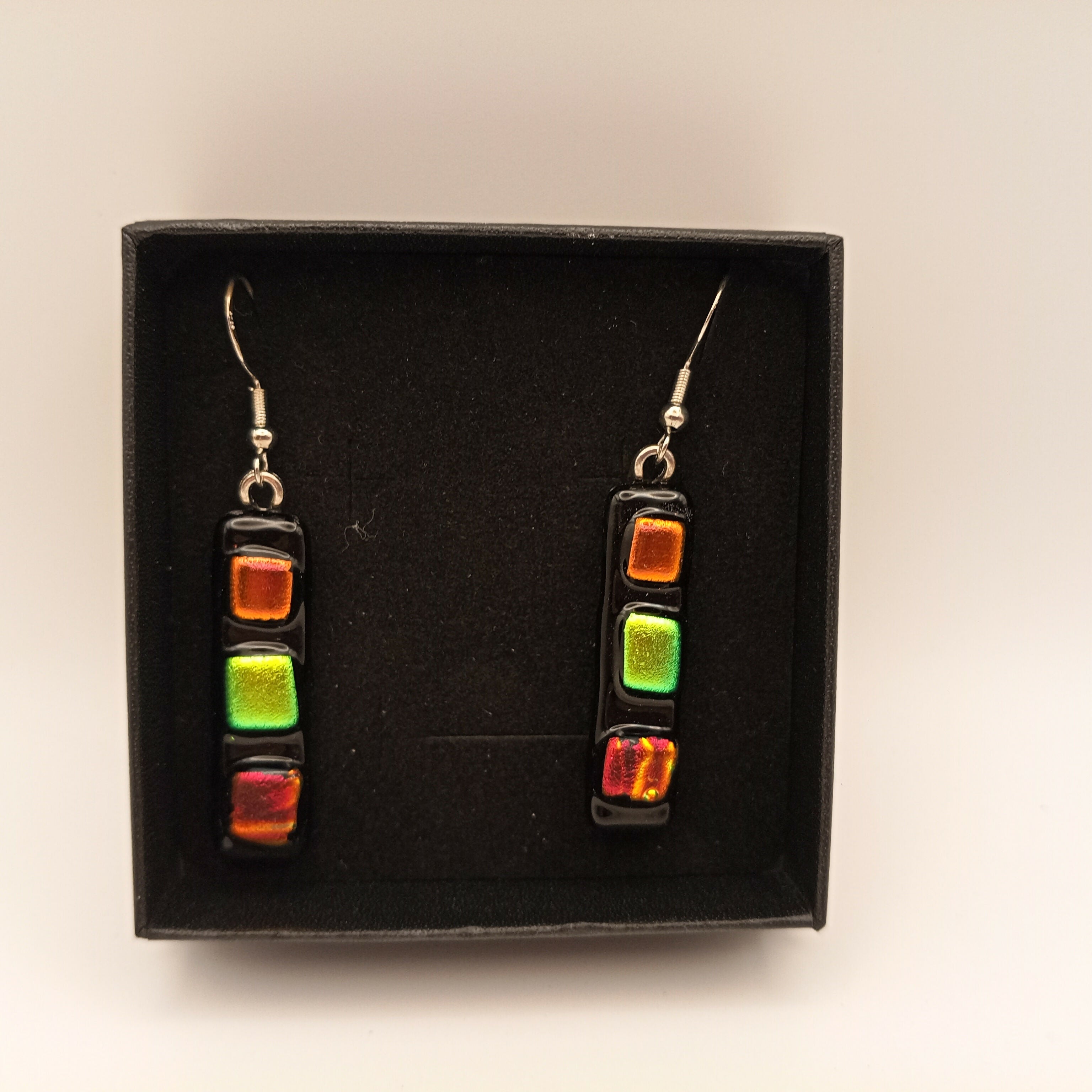 Orange, Green and Red Glass Earrings on Black