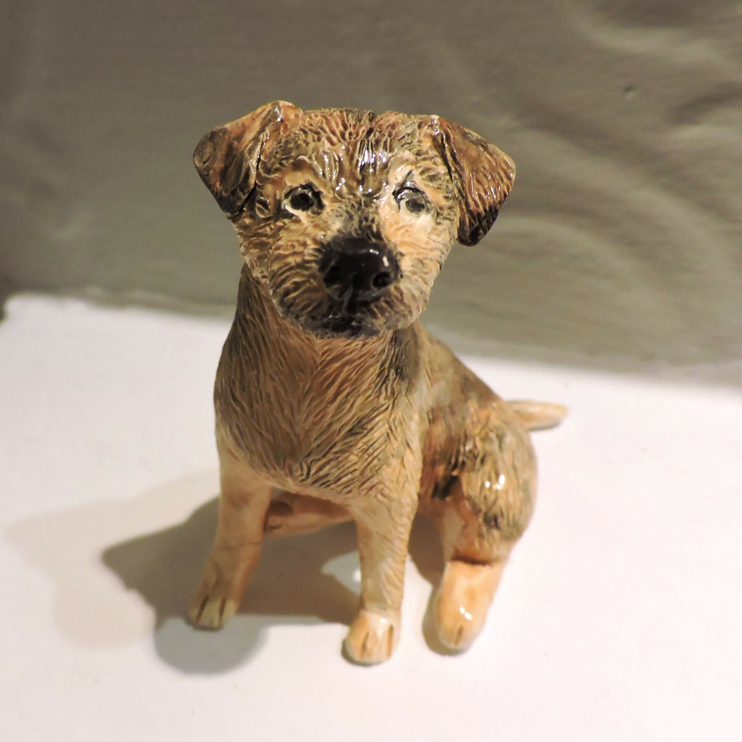 Ceramic border terrier dog sculpture