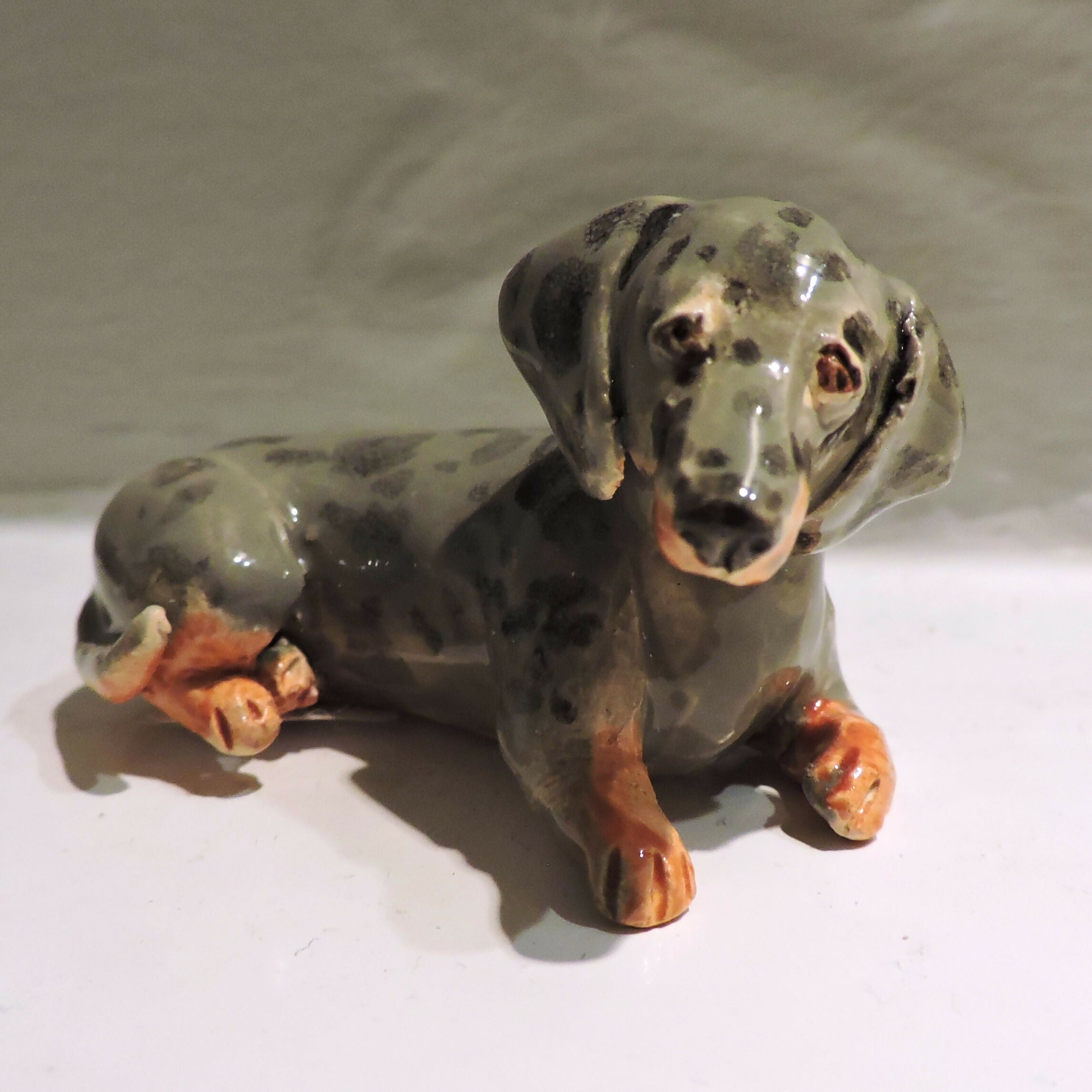 Ceramic silver dapple dachshund sculpture