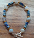 Gemstone Bracelet with a Tibetan Silver Toggle Catch, Banded Grey Agate, Bronze Hematite and Lapis Lazuli Cubes.