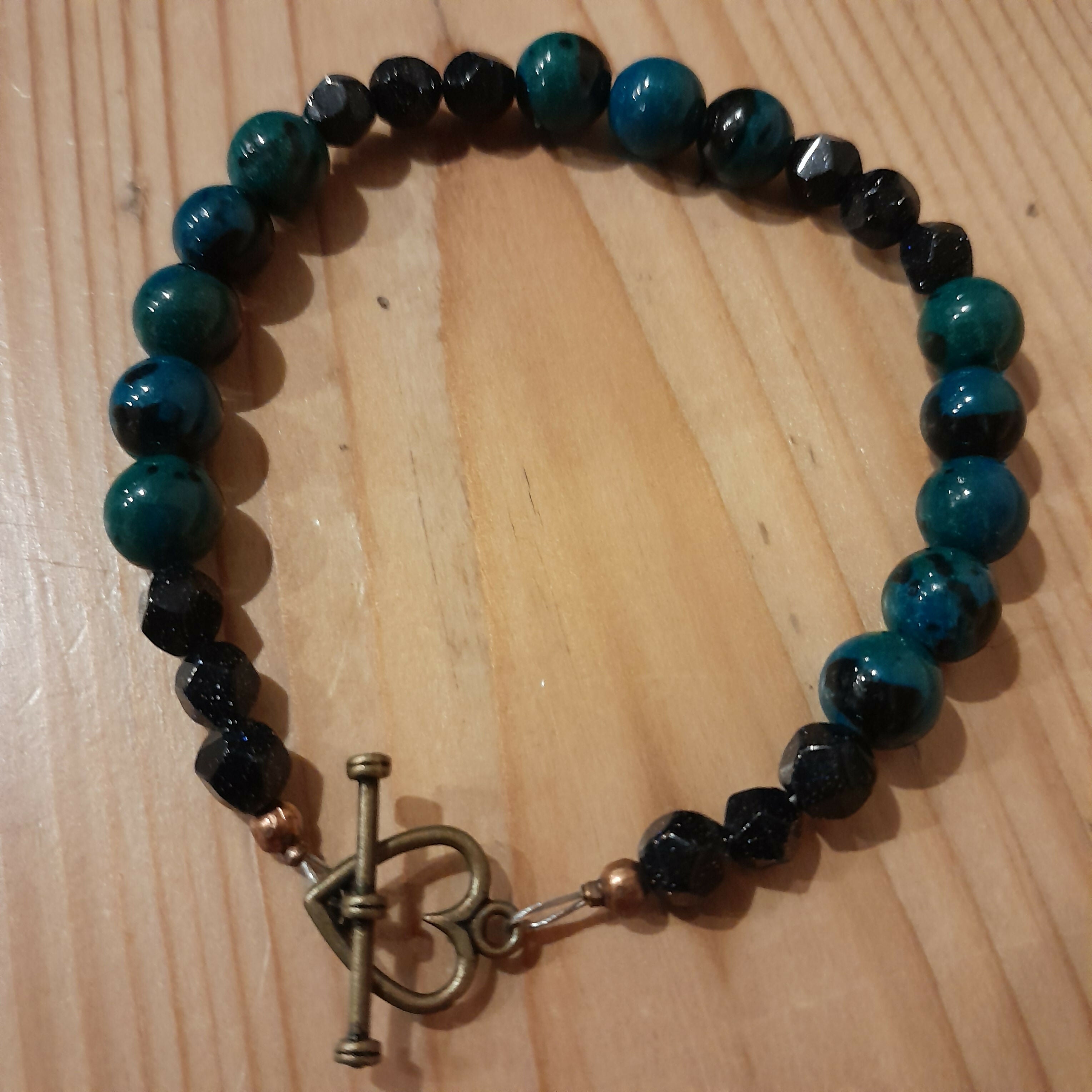 Bronze Toggle Catch Bracelet with Faceted Navy Blue Goldstone and Chrysocolla.